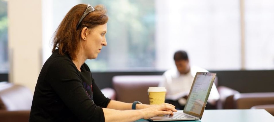 Woman typing on laptop