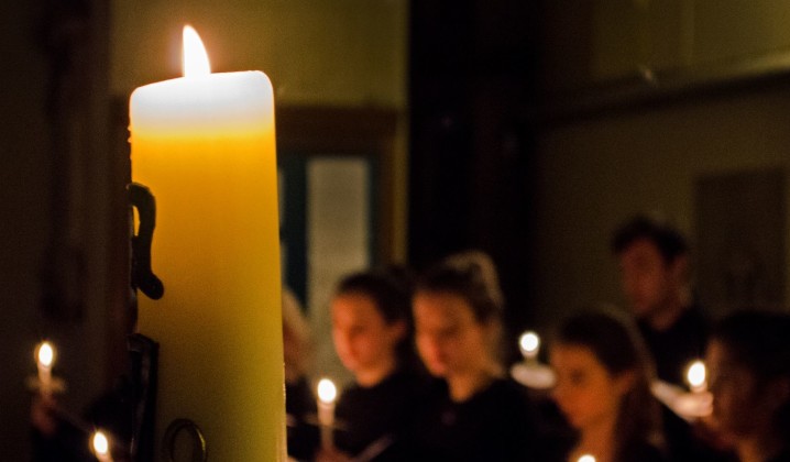 picture of choir singing and candle