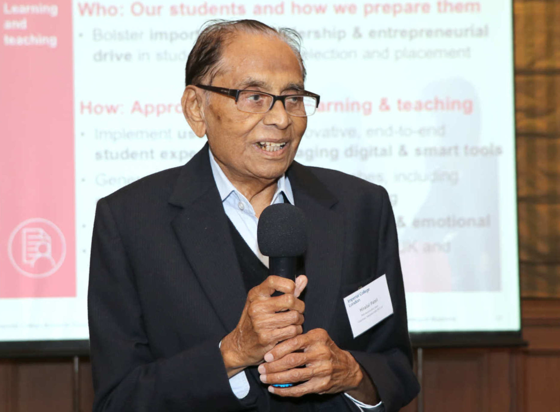 Dr Hiralal Patel speaking at an alumni event in 2018