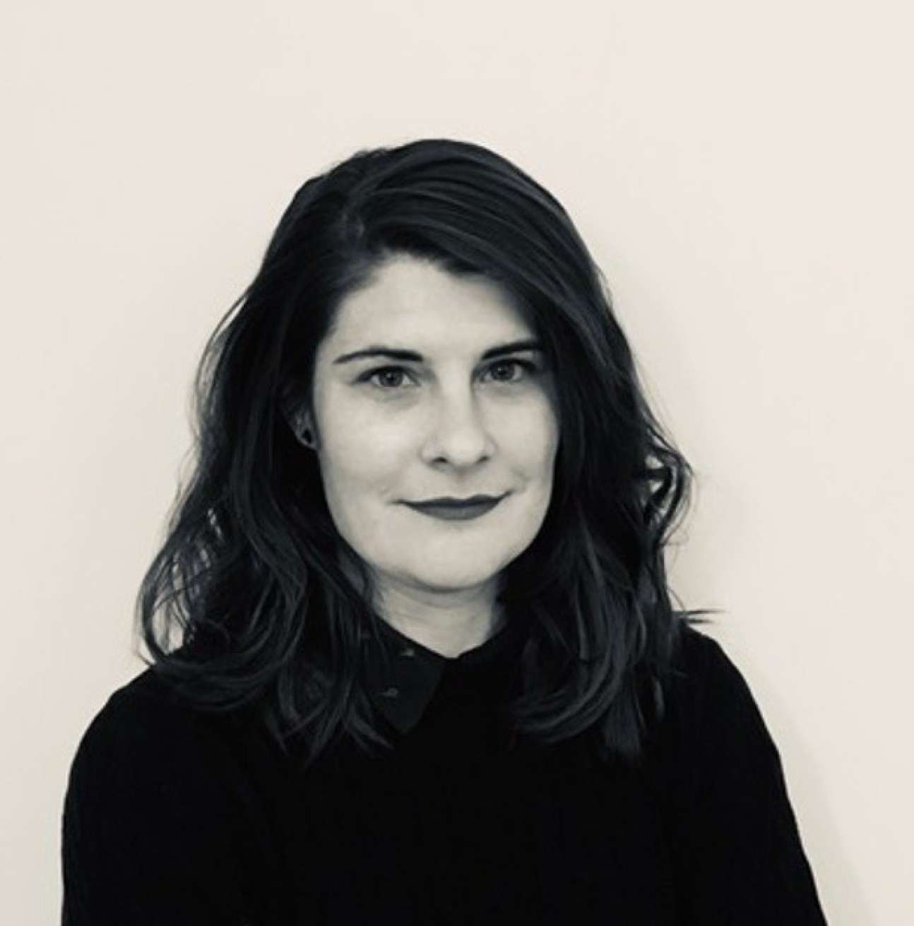 Black and white portrait image of woman with long hair