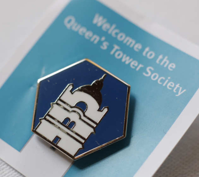 Members of the Queen's Tower Society receive a commemorative lapel pin