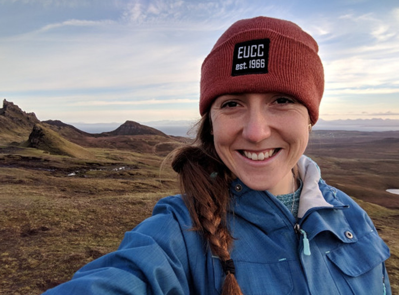 Dr Sacha Corby on a hillside