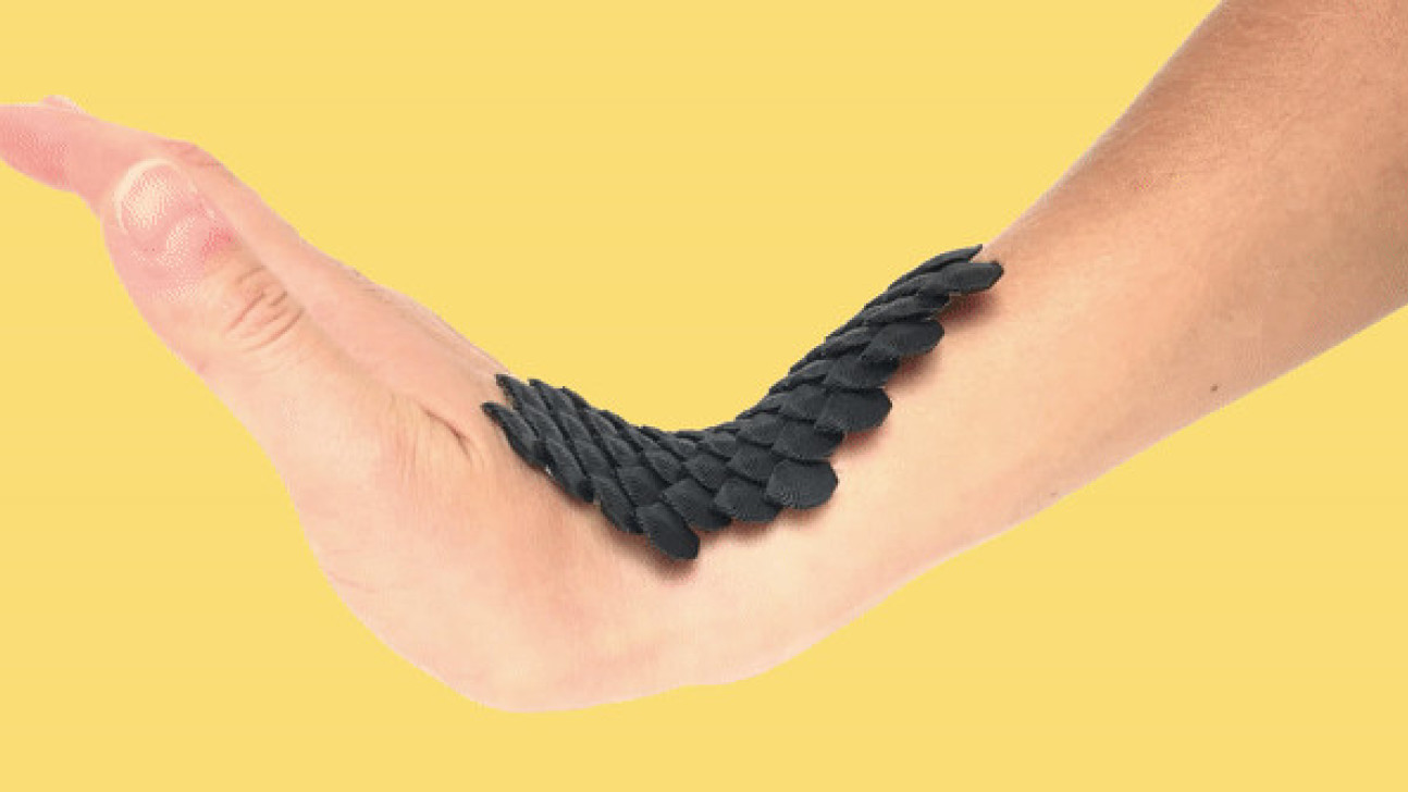 A hand wearing SCALED's flexible wearable