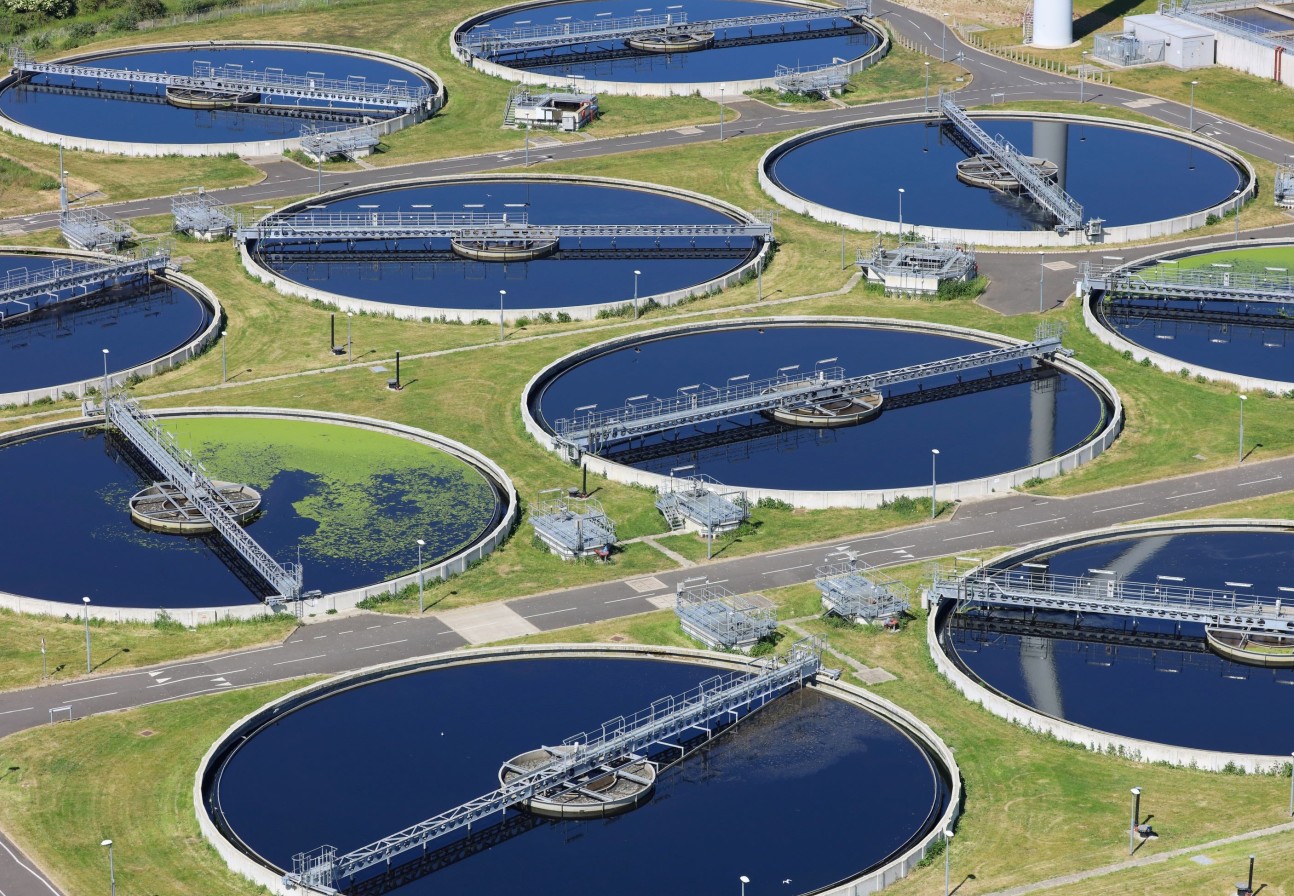 Aerial view of a wastewater treatment works composed of circular ponds