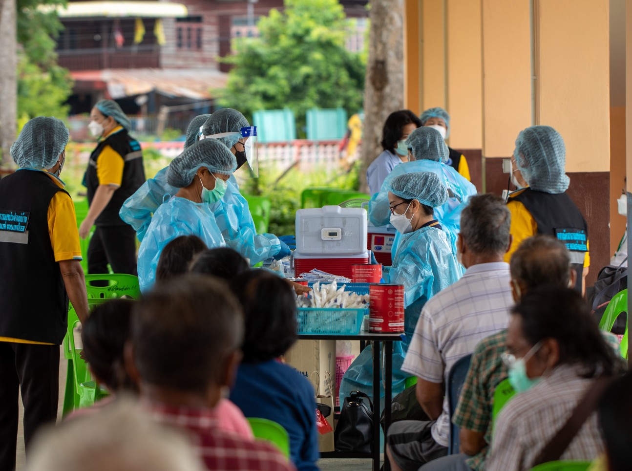A team distributing vaccines in Thailand