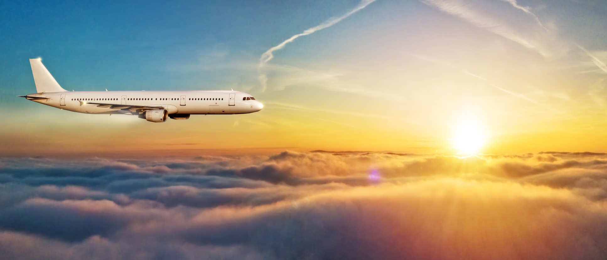 Photo of plane flying above clouds