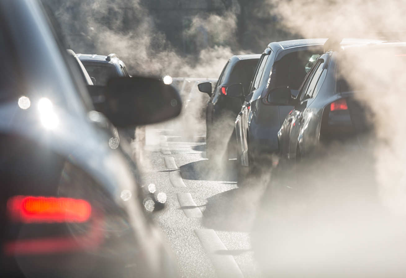 Cars on a road with pollution