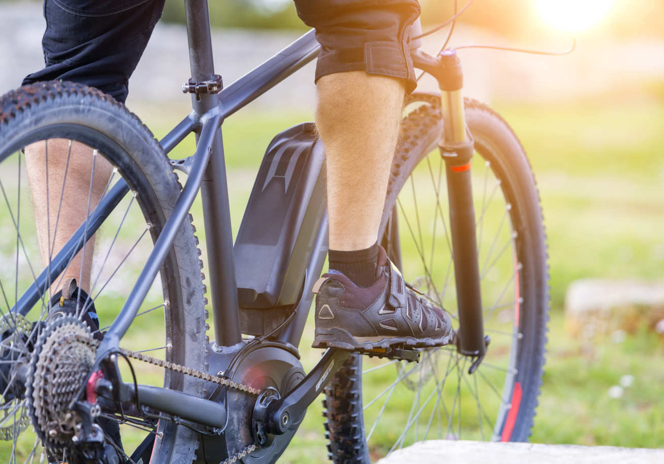 Close up of a bike frame with a small motor