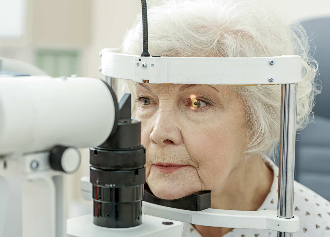 An elderly woman getting an eye test
