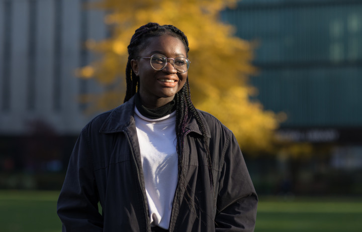 A student on the Queen's Lawn on our South Kensington Campus