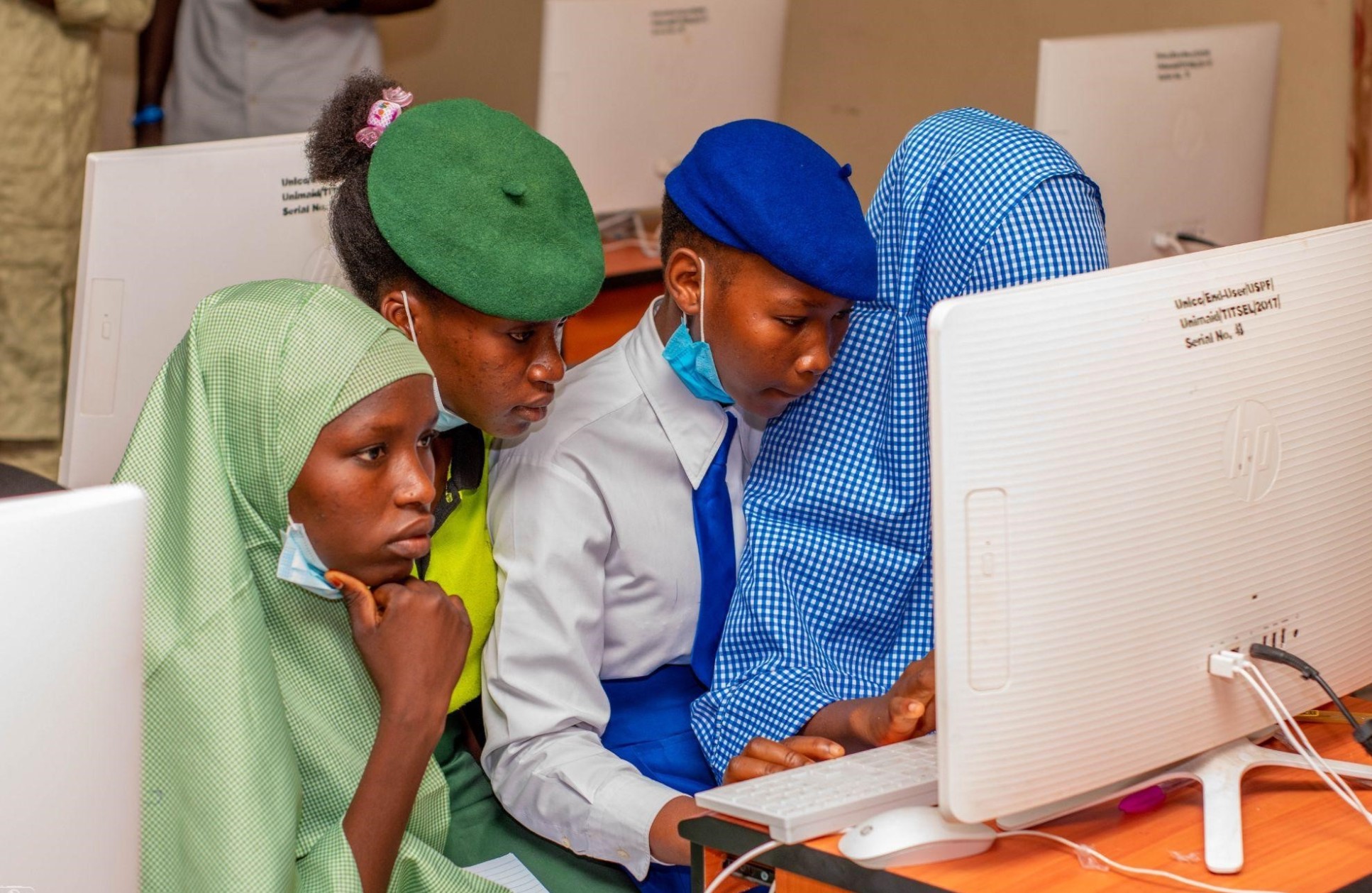 Students work together at computer