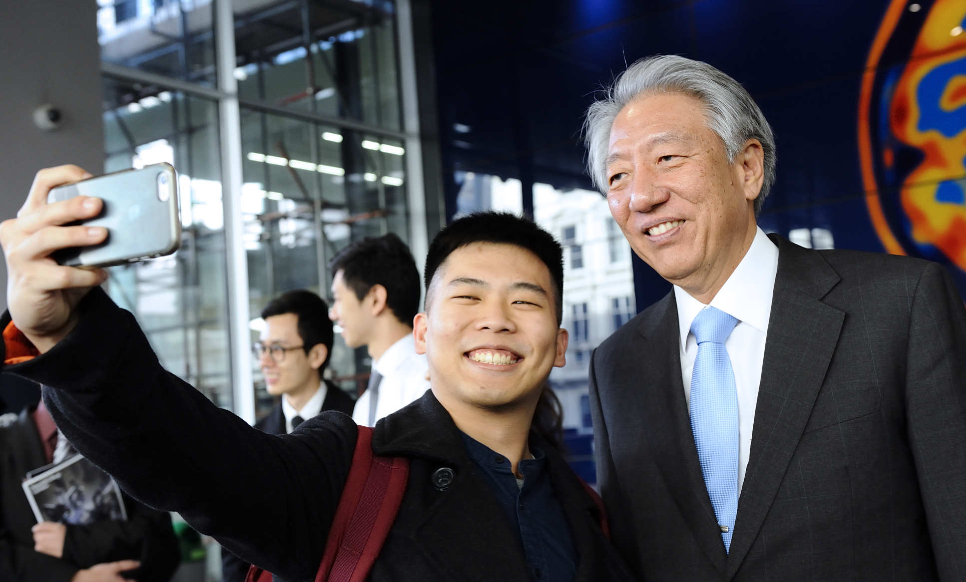 A student takes a selfie with Mr Teo