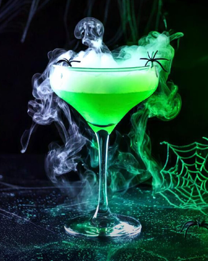 Green Spooky Drink with fog and spiders coming out of it