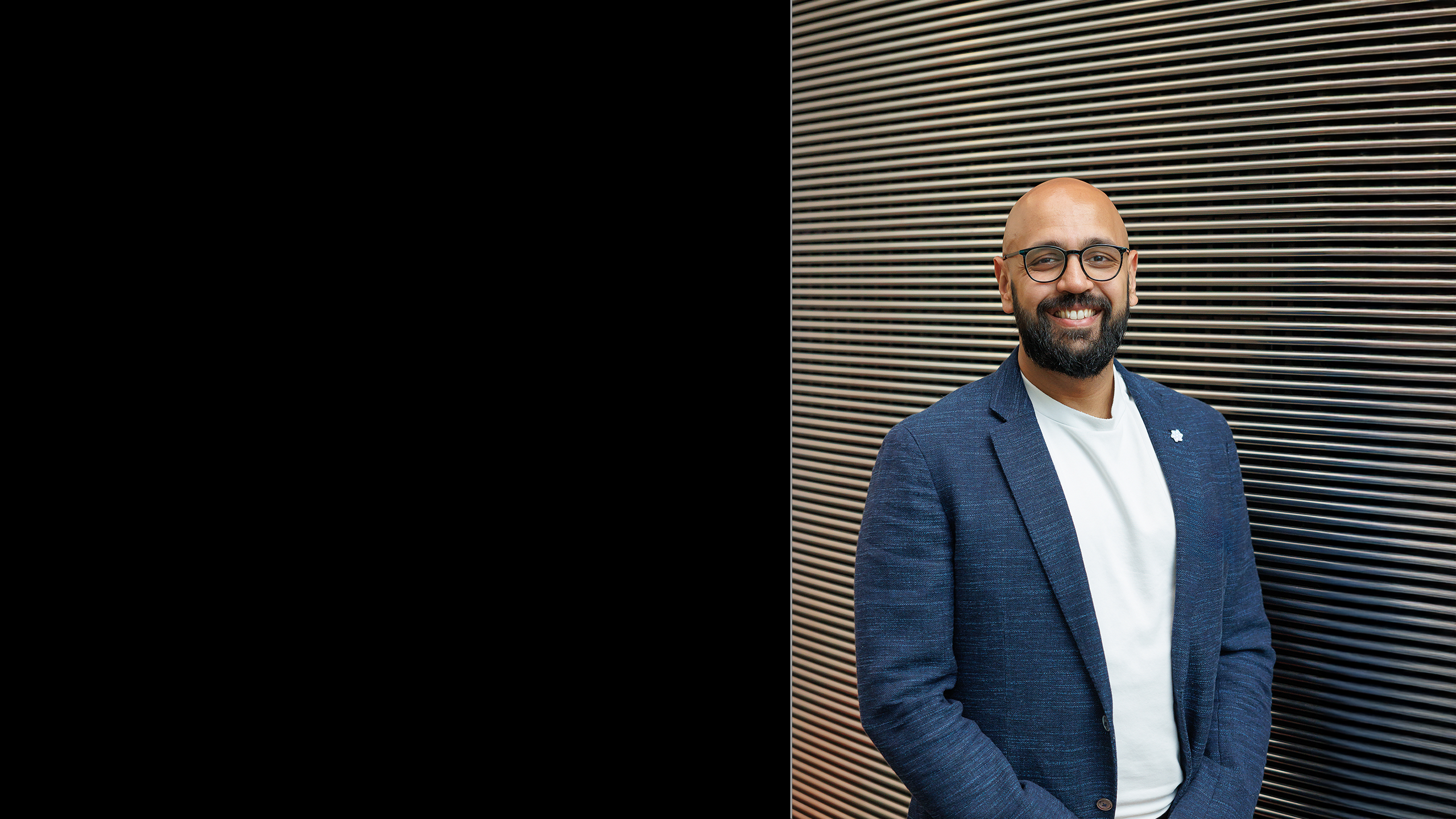 Raj Bharat standing in front of Imperial Business School
