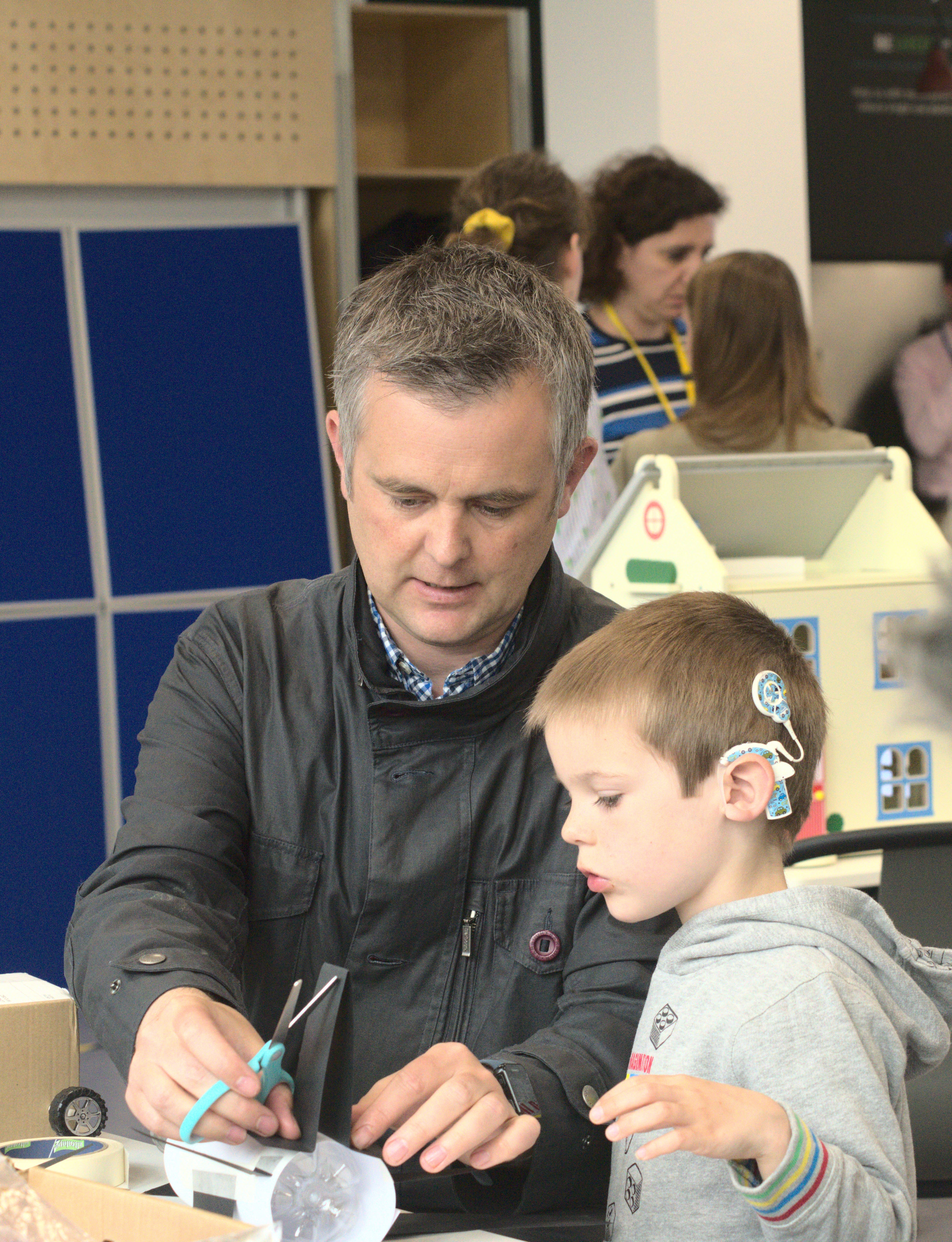 Professor Kelly showing some school children a piece of equipment