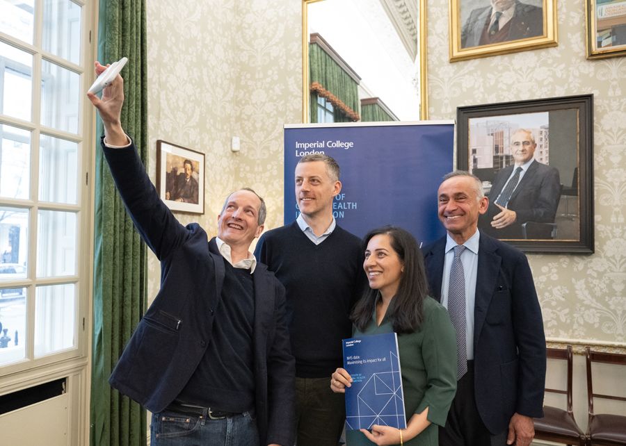 Four people pose for a selfie