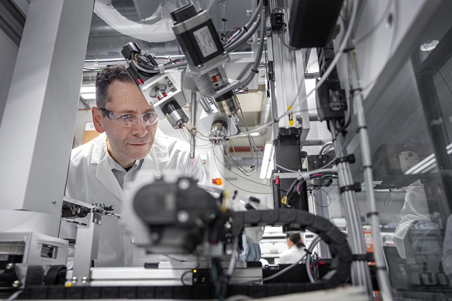 Professor with scientific instrument