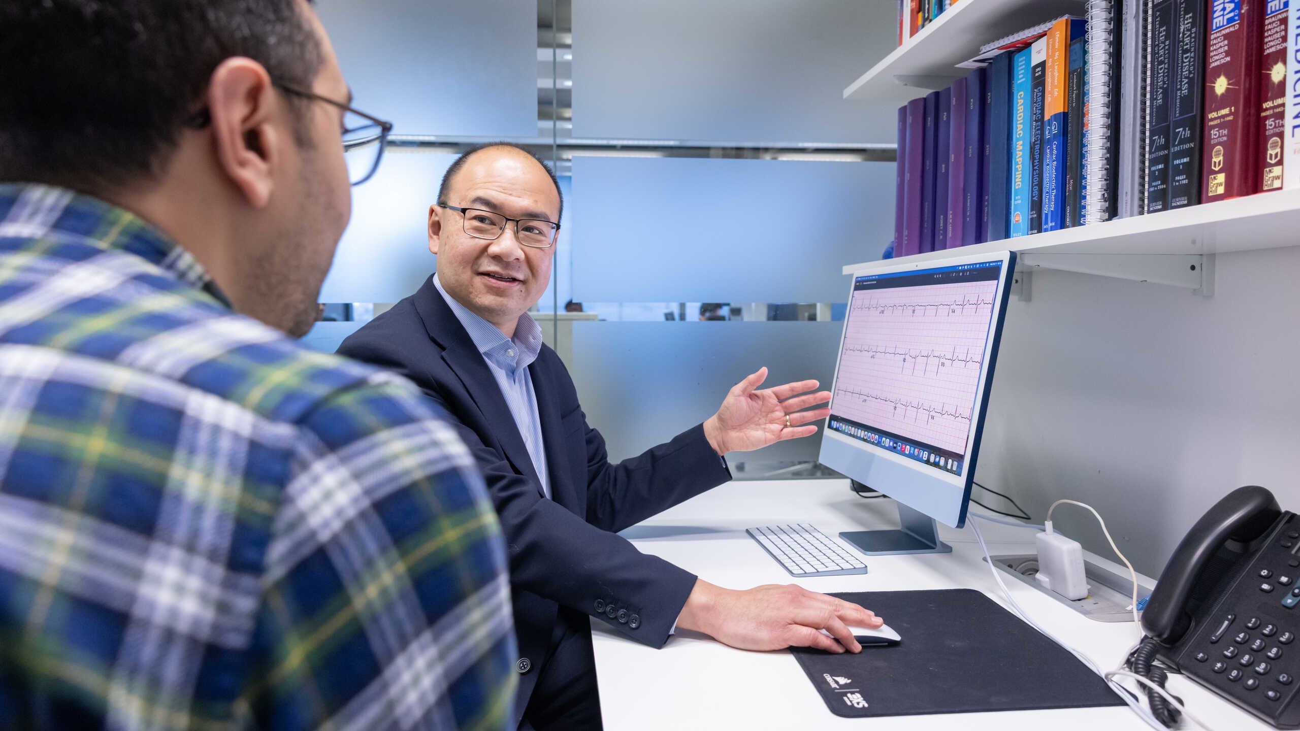 Professor Fu Siong Ng and Hesham Aggour discuss AI-ECG research.