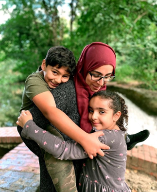 Amina with her two children, Husain and Aya