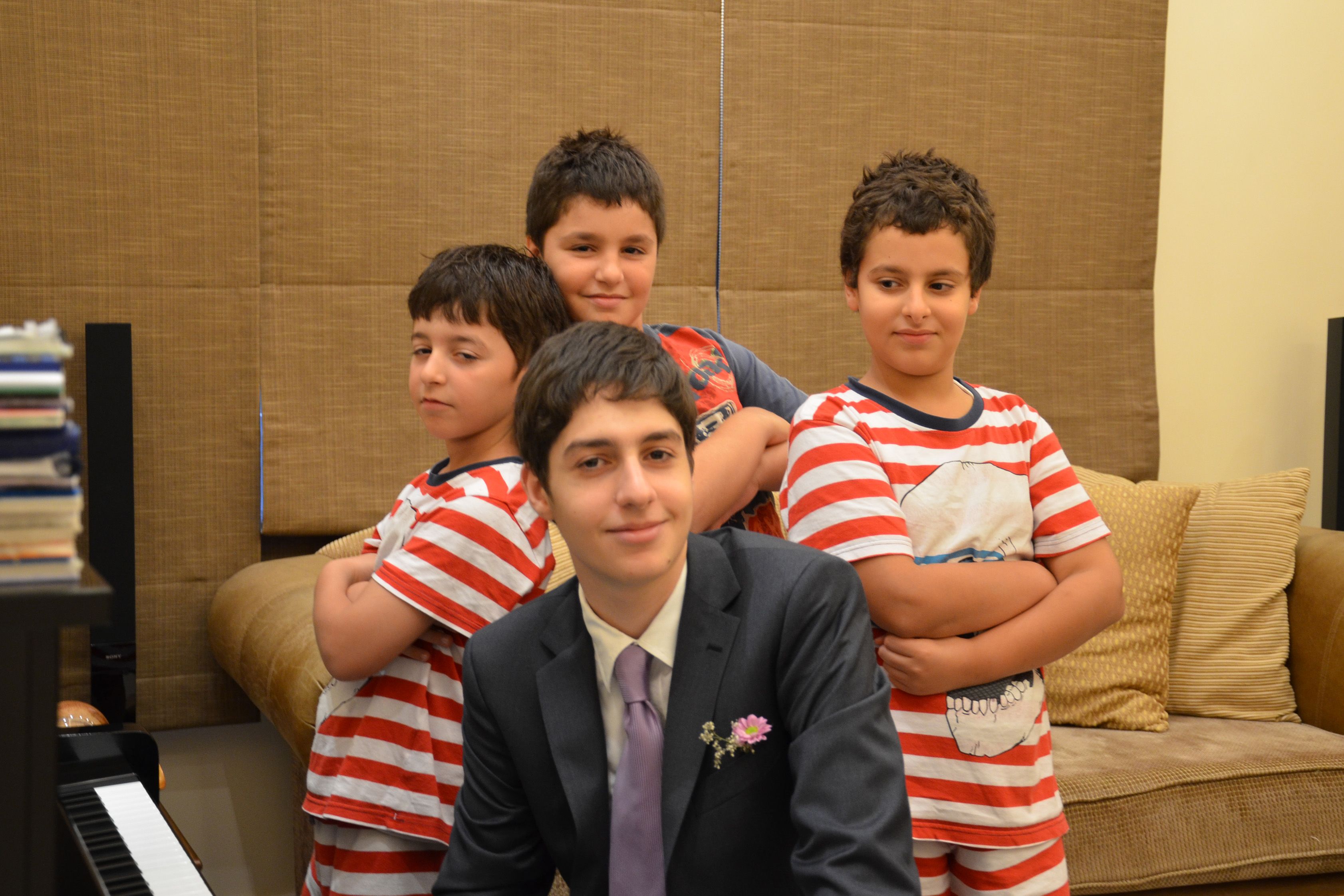 Jean Marc and his younger brothers Christian, Carl, and Dani, before Jean Marc’s secondary school prom.