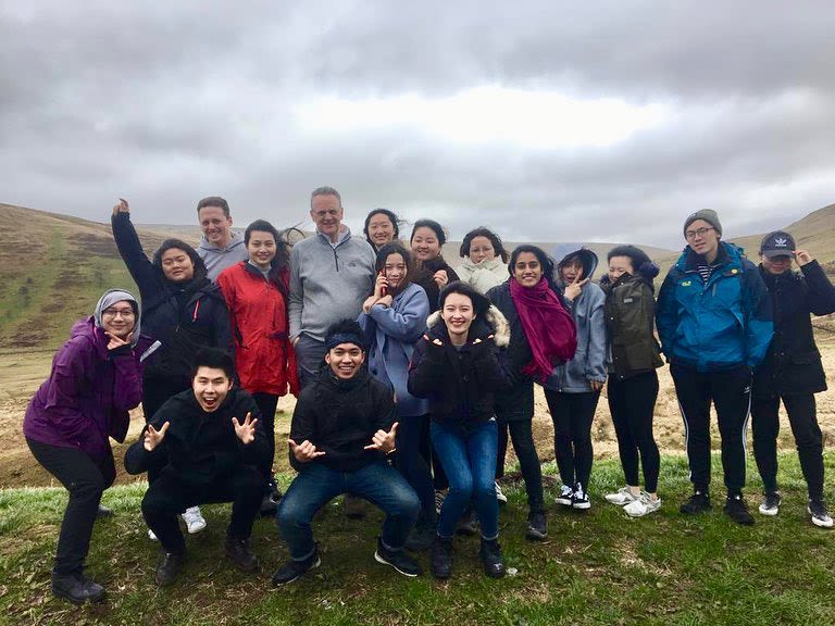 A group photo of Agung's cohort in the Welsh countryside