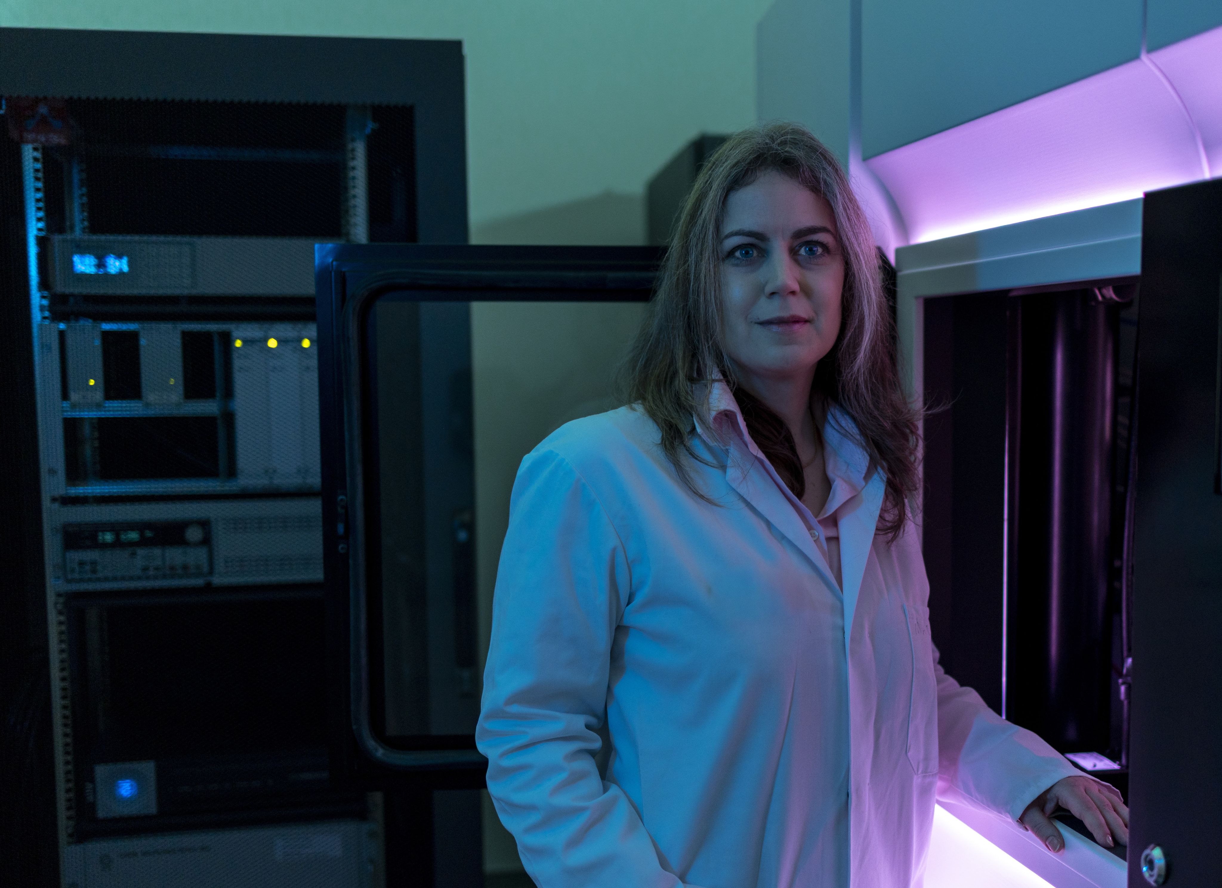 Ibolya Kepiro in her lab wearing a lab coat