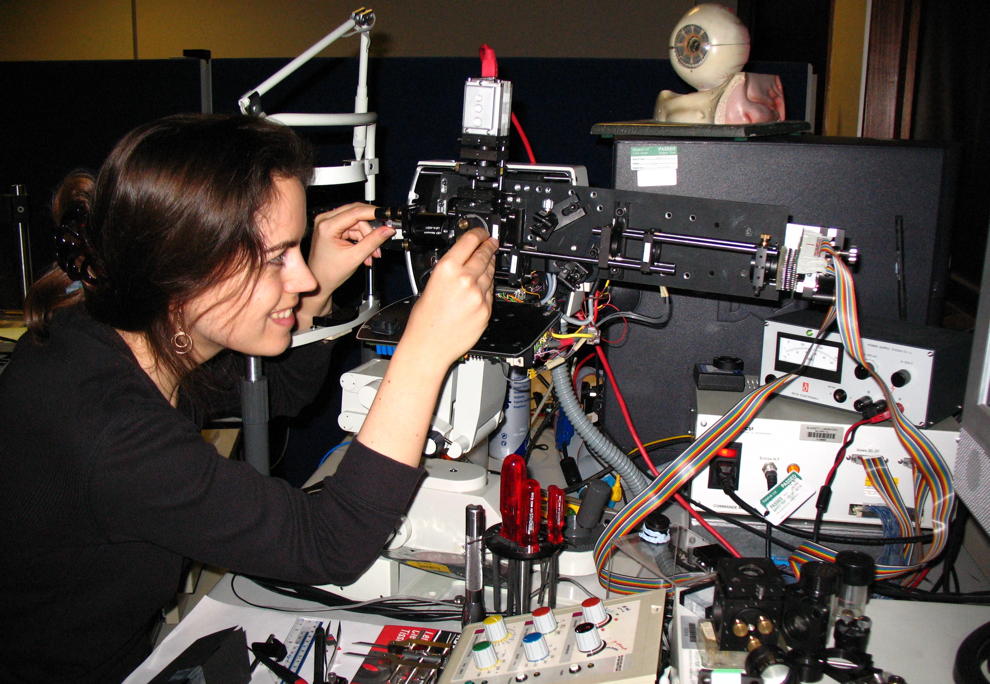 Ibolya adjusting scientific equipment