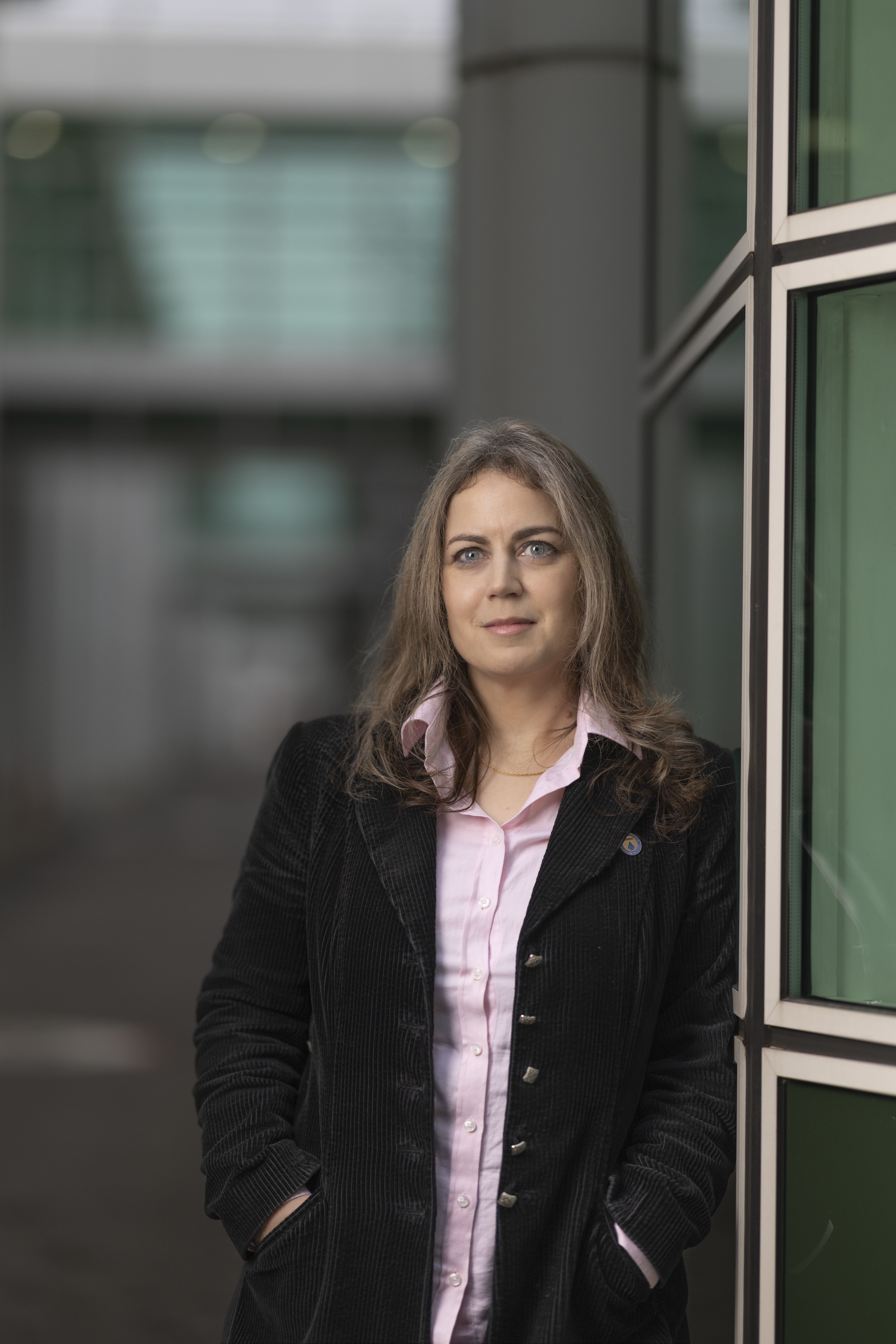 Ibolya Kepiro stood outside wearing a jacket and pink shirt