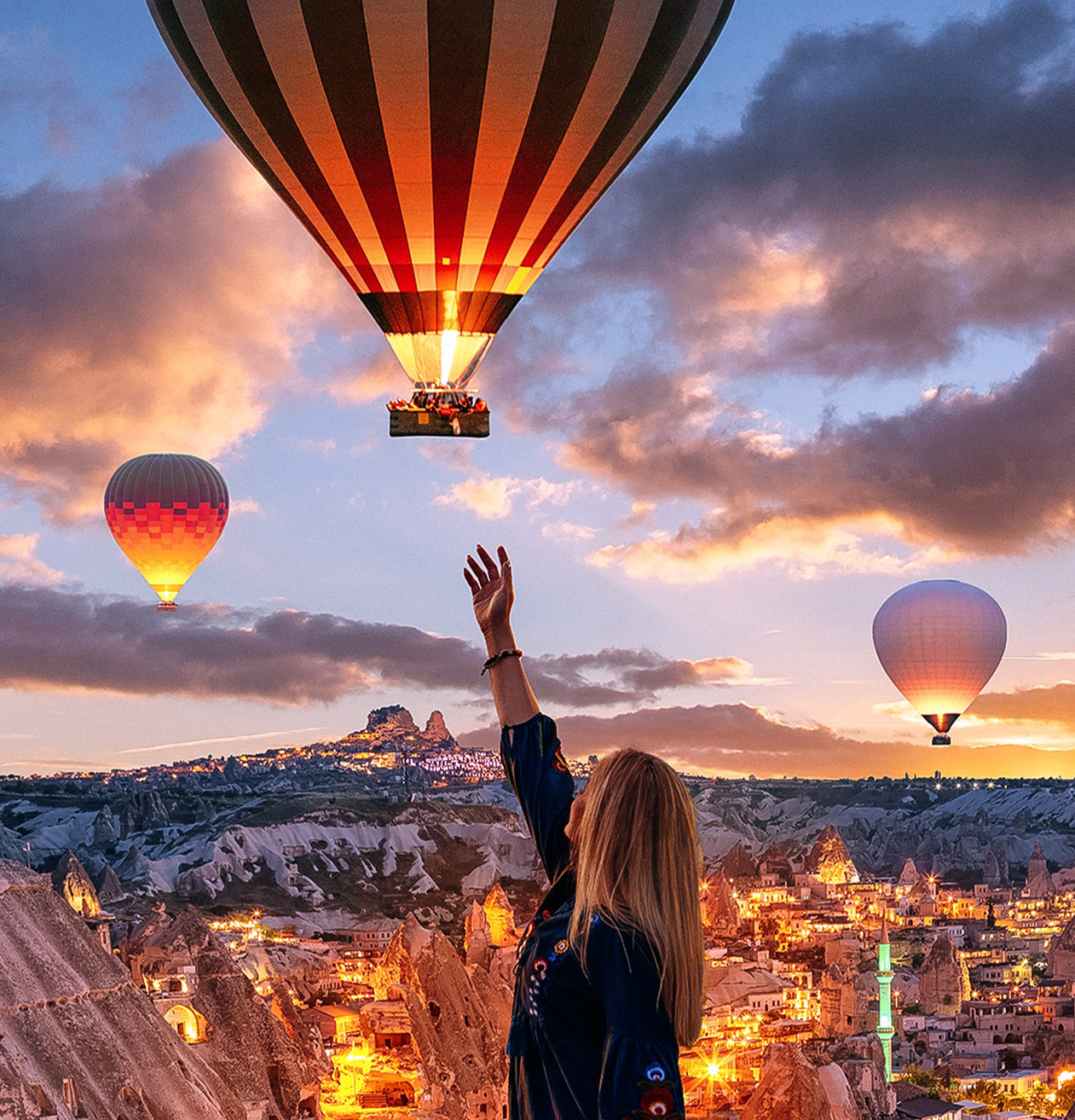 Ibolya flanked by her parents stood outside in front of a statue