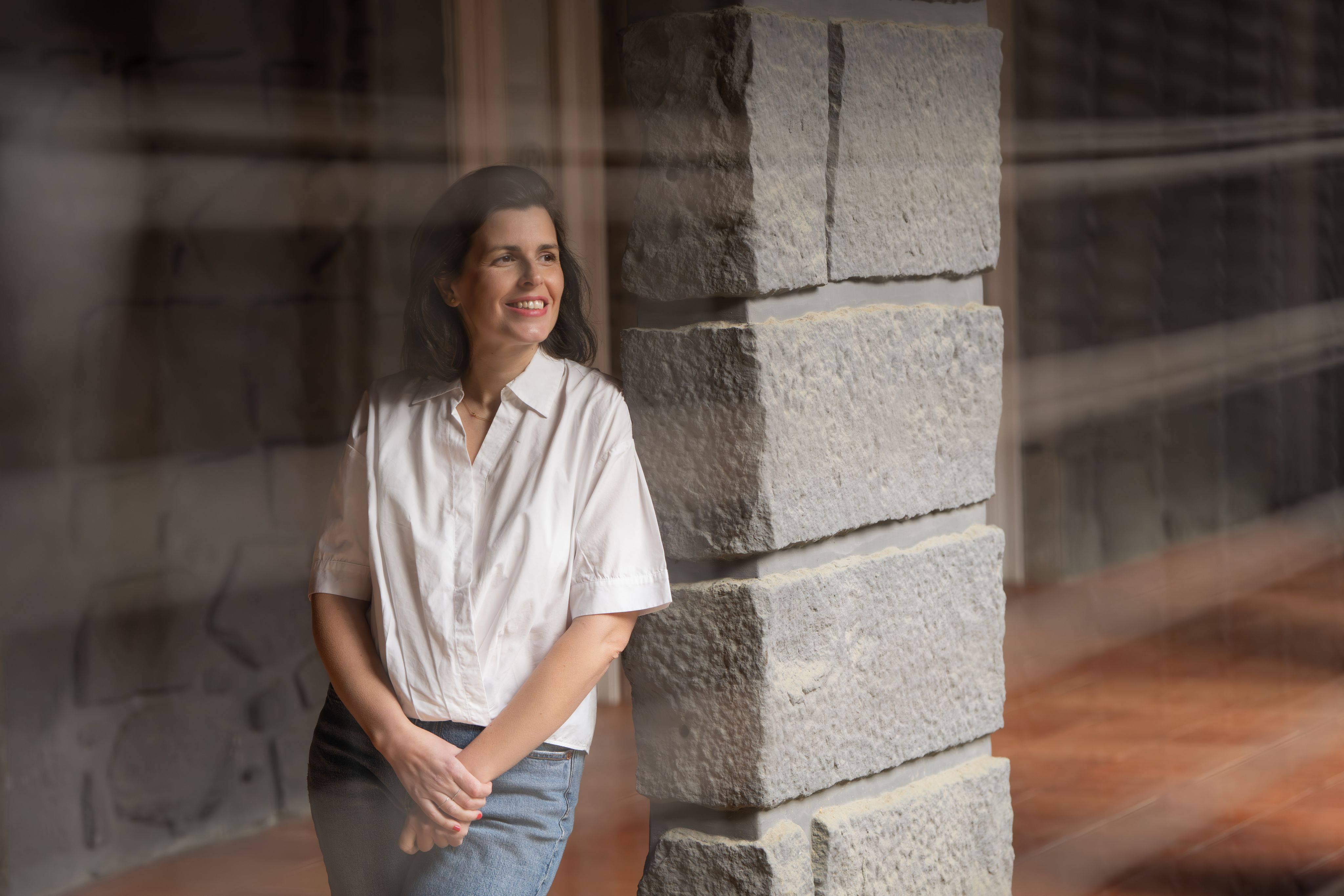 Joana Moscoso wearing a white shirt