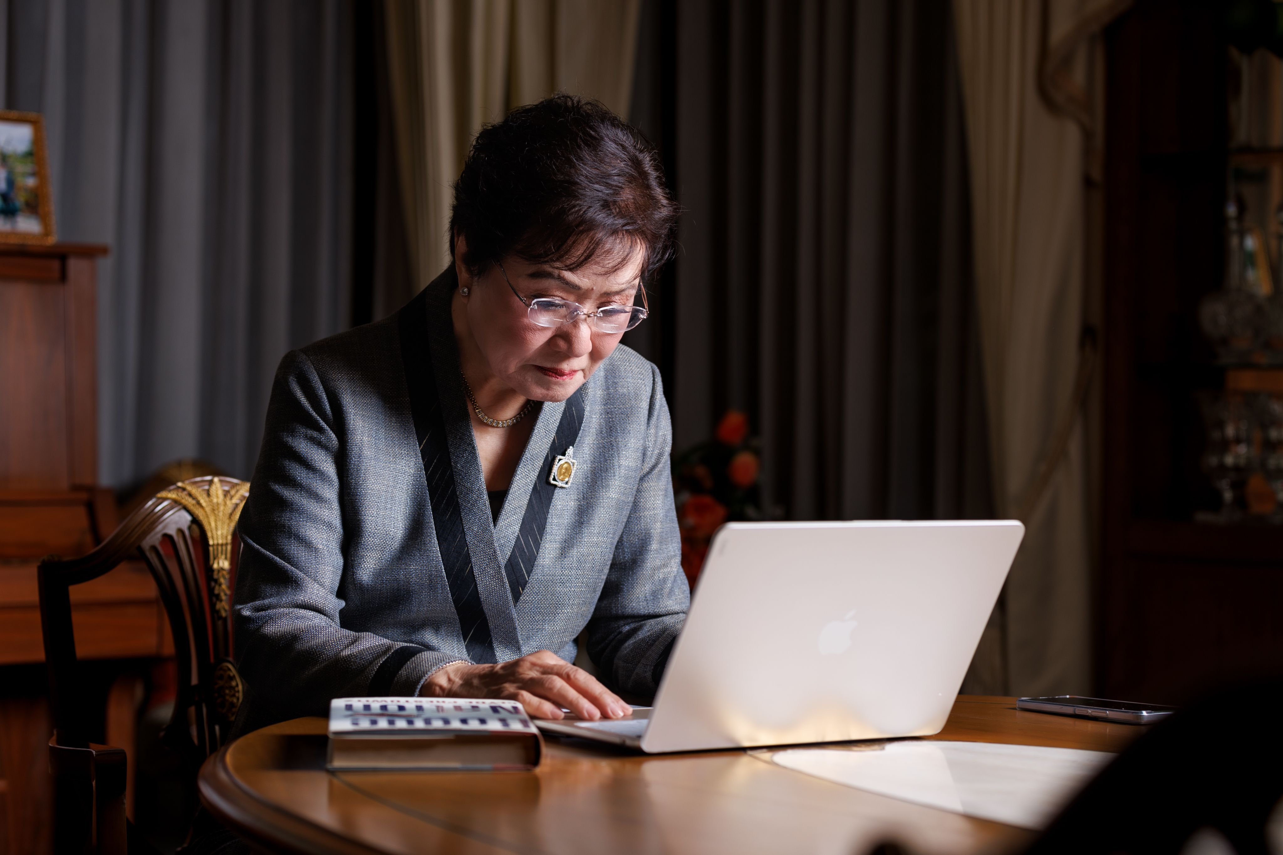 Kalaya Sophonpanich sat at her desk in front of her laptop