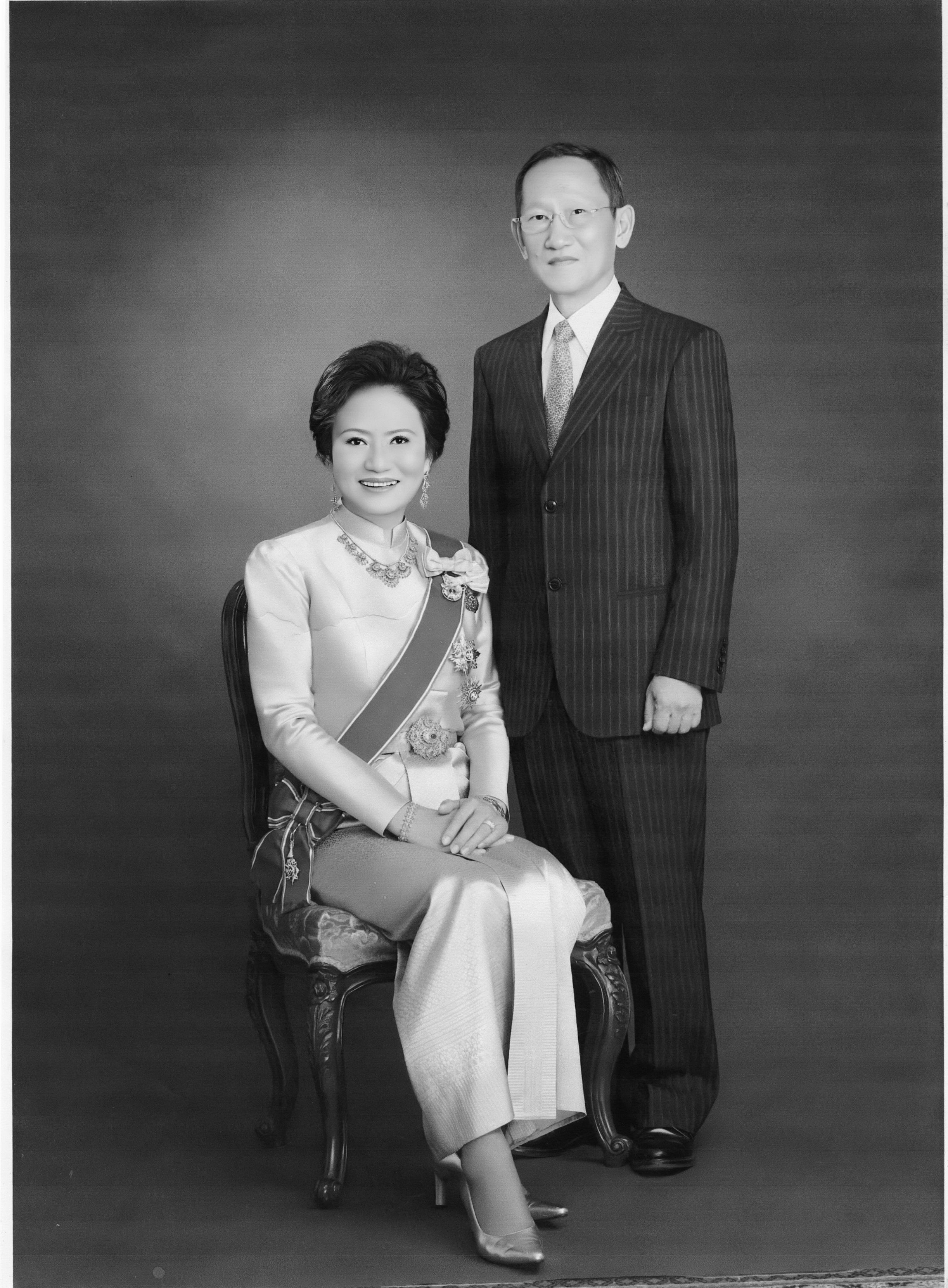 A black and white photo of Kalaya Sophonpanich in ceremonial dress with her husband