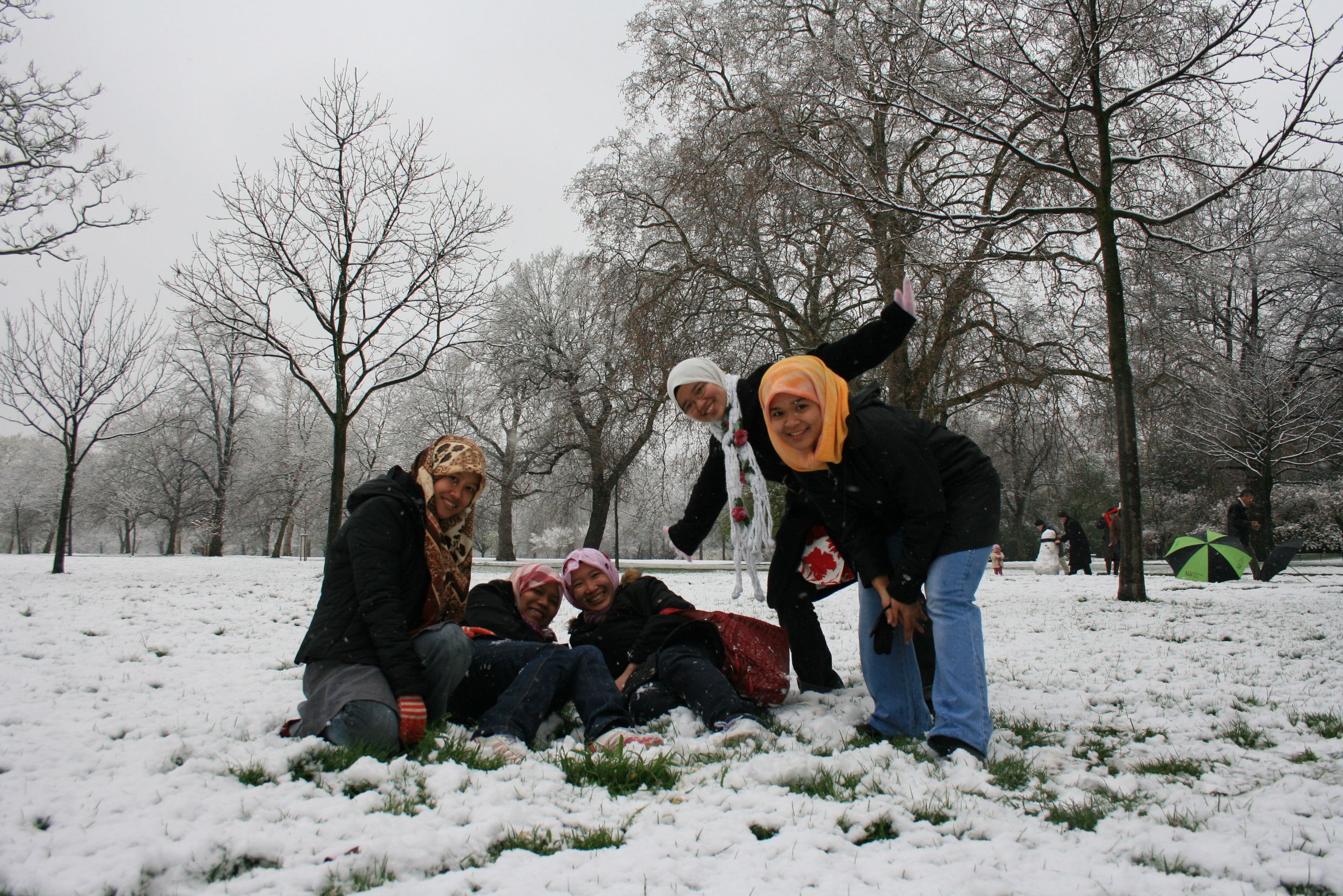 A group photo of 5 girls playing in the snow