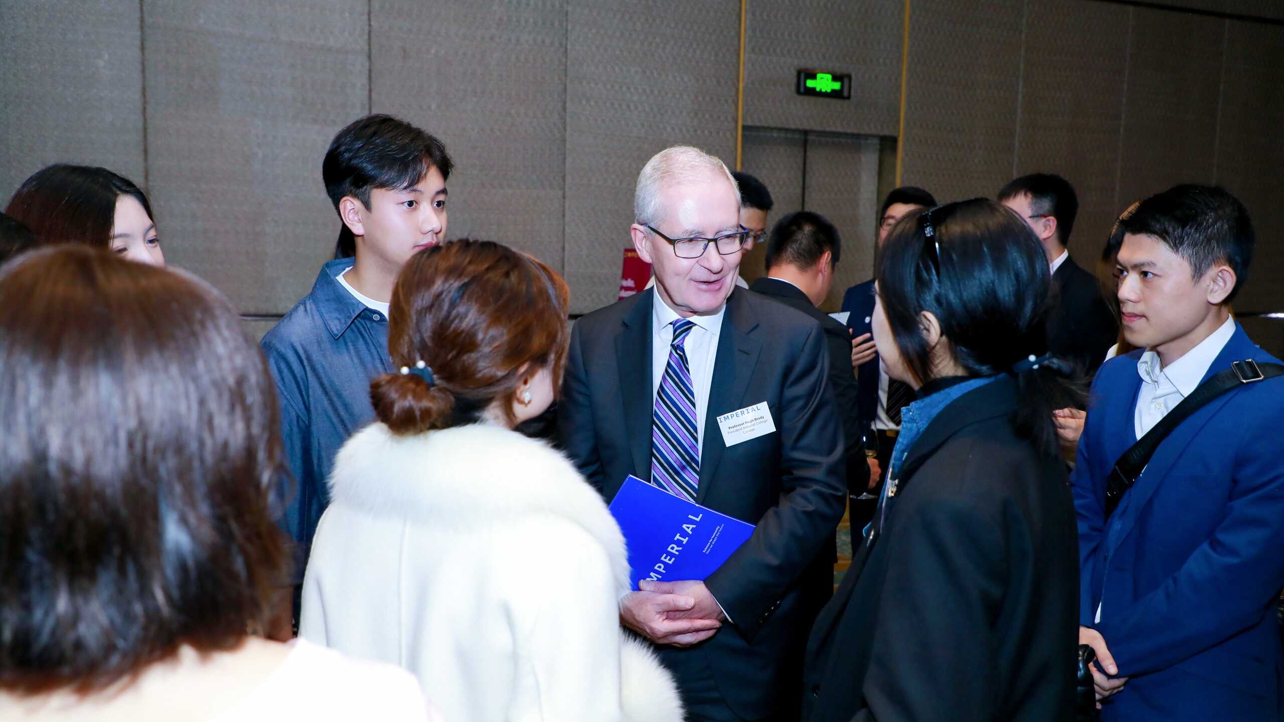 Professor Hugh Brady meets alumni at a reception in Shanghai