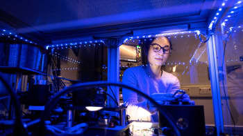 A PhD student in the lab, working on quantum projects
