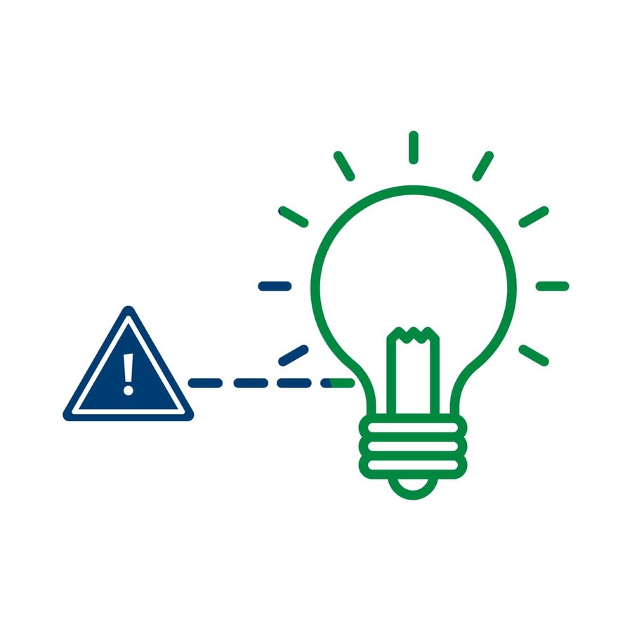 a light bulb with a warning sign