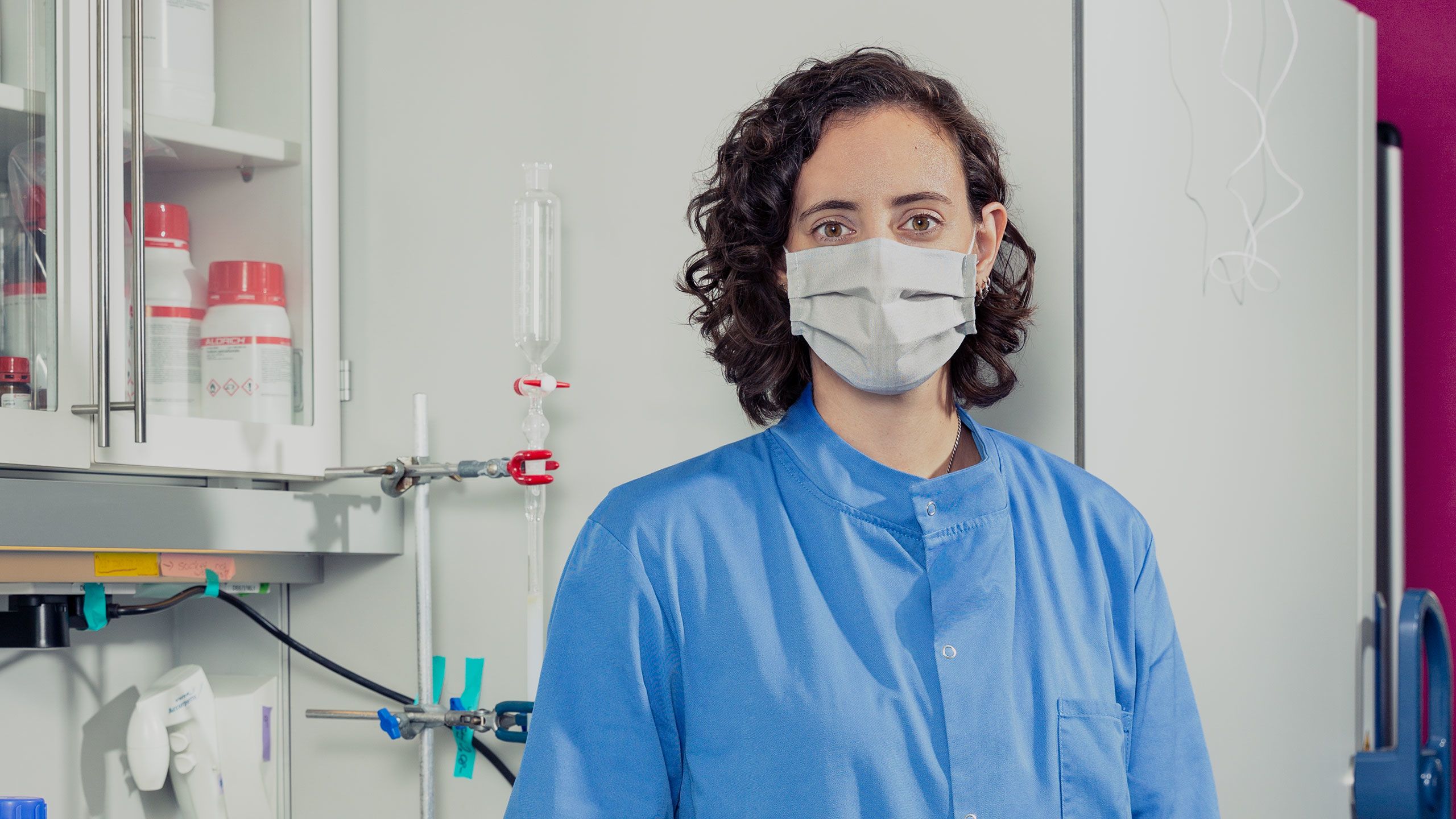 Marta Broto Aviles, Postdoctoral Research Associate standing in the lab.