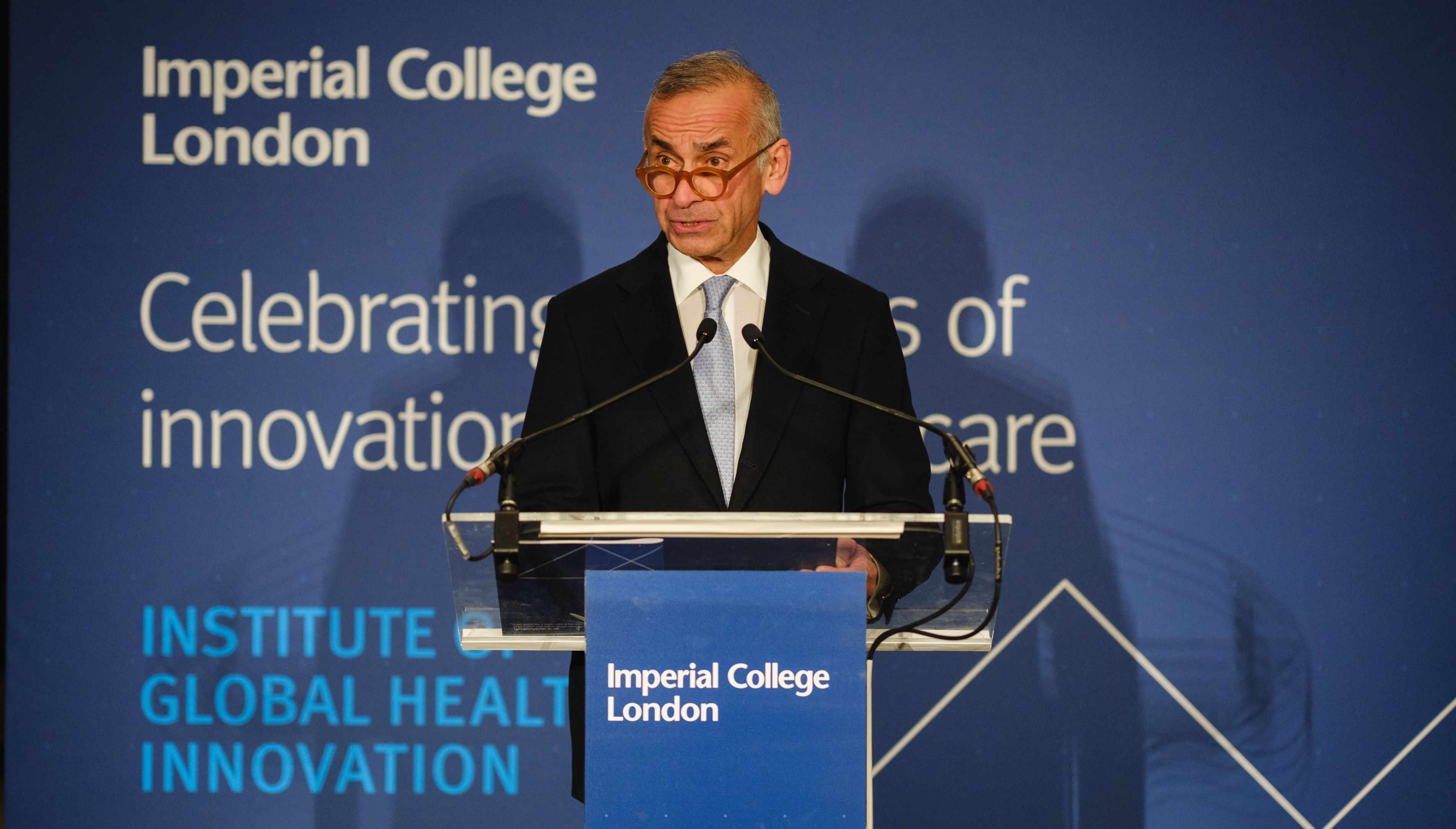 Professor Lord Ara Darzi speaking at a podium