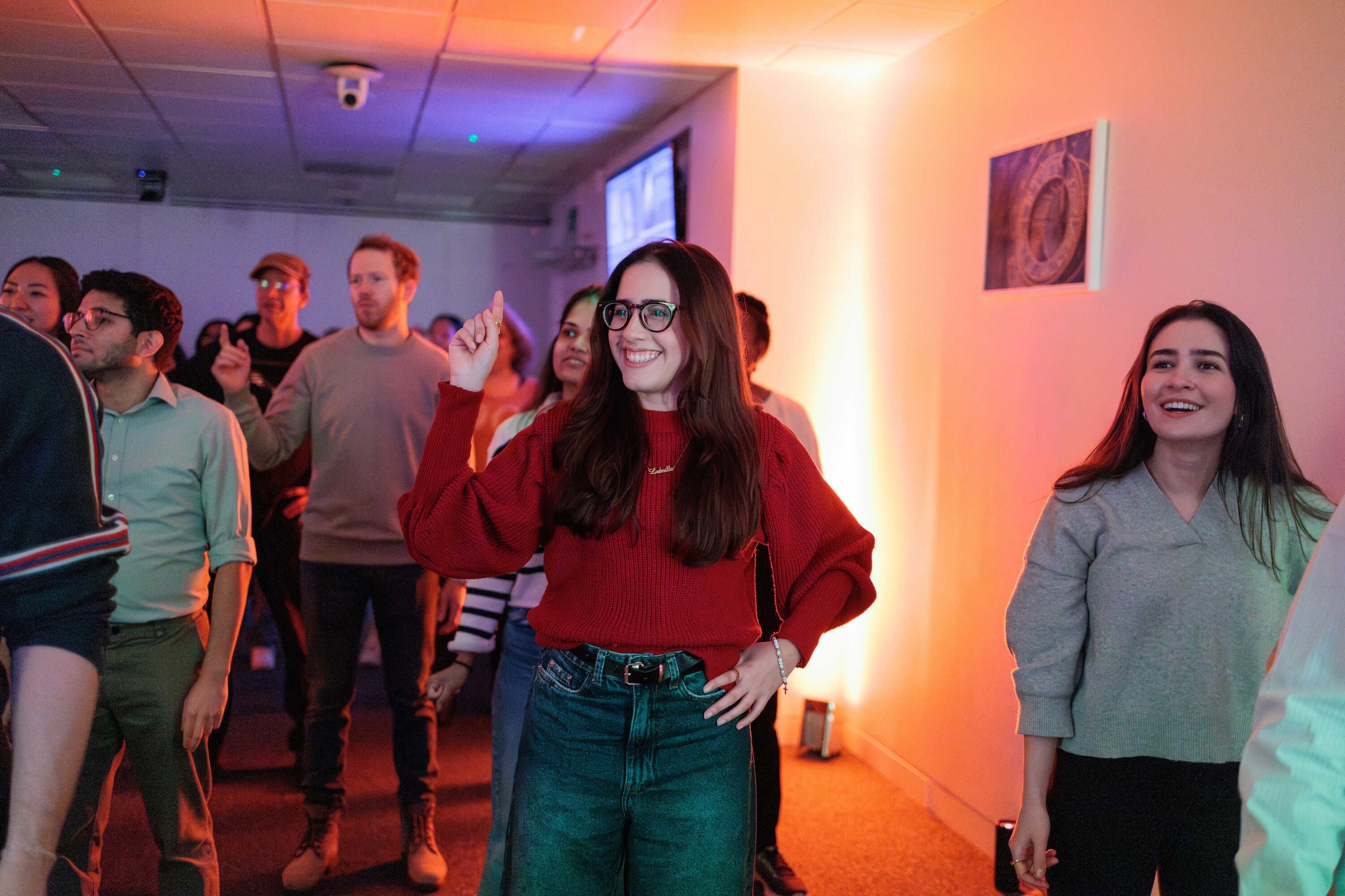 A group of people smiling in a dance class