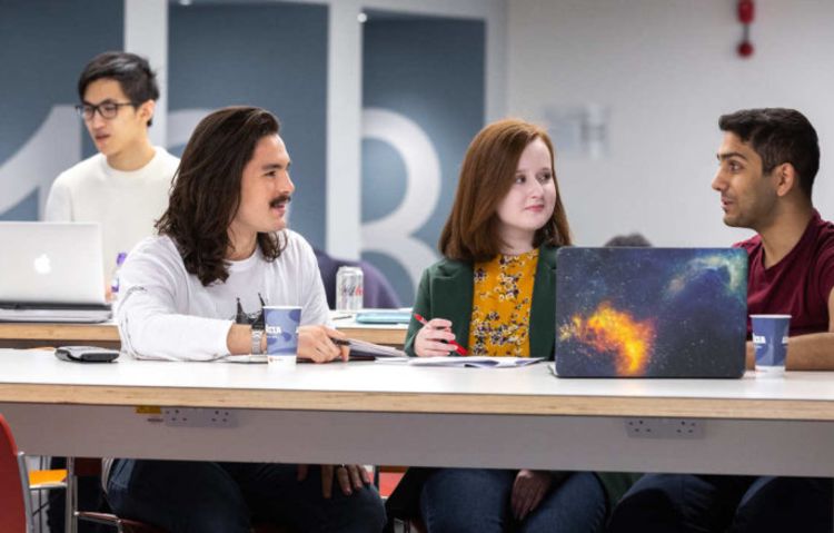 Students studying in the College café.