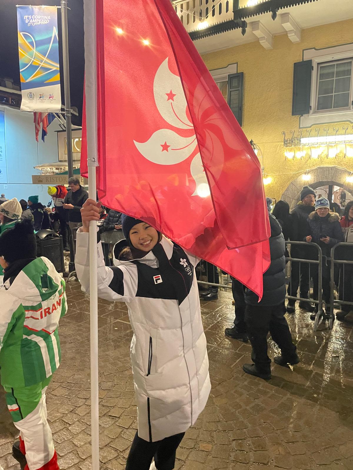 Eloise posing with Hong Kong flag
