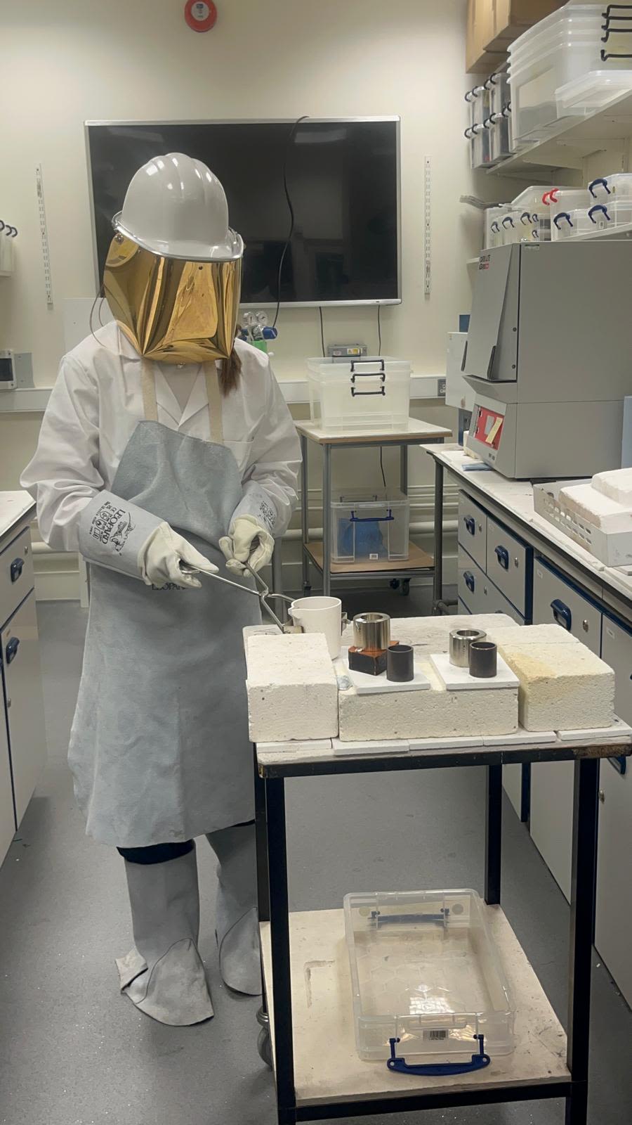 Eloise in the lab wearing full PPE 