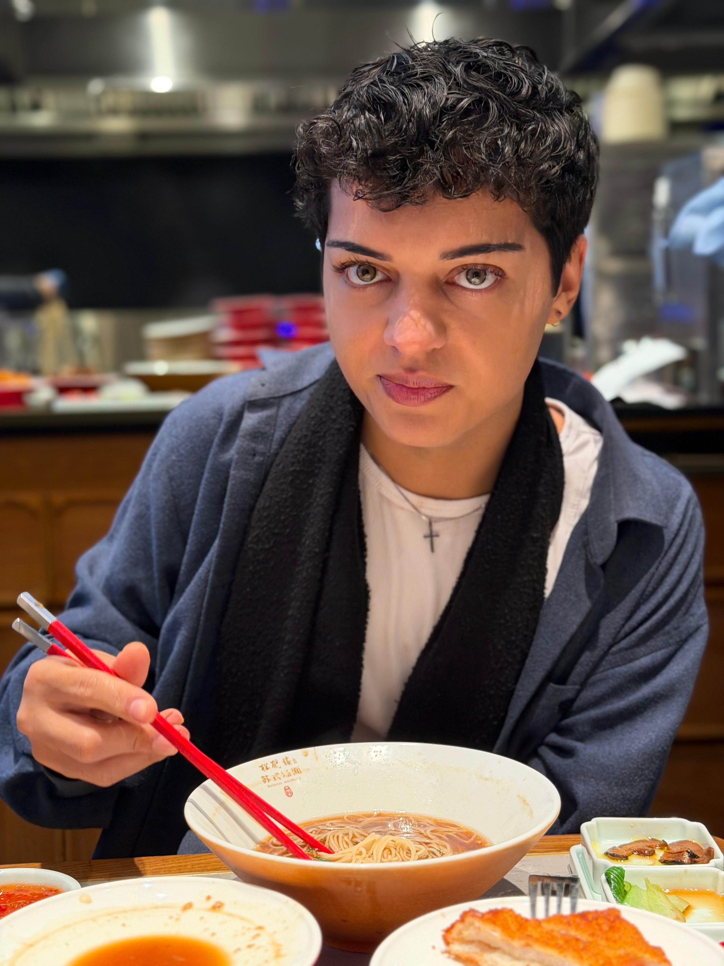 Emil with a bowl of ramen