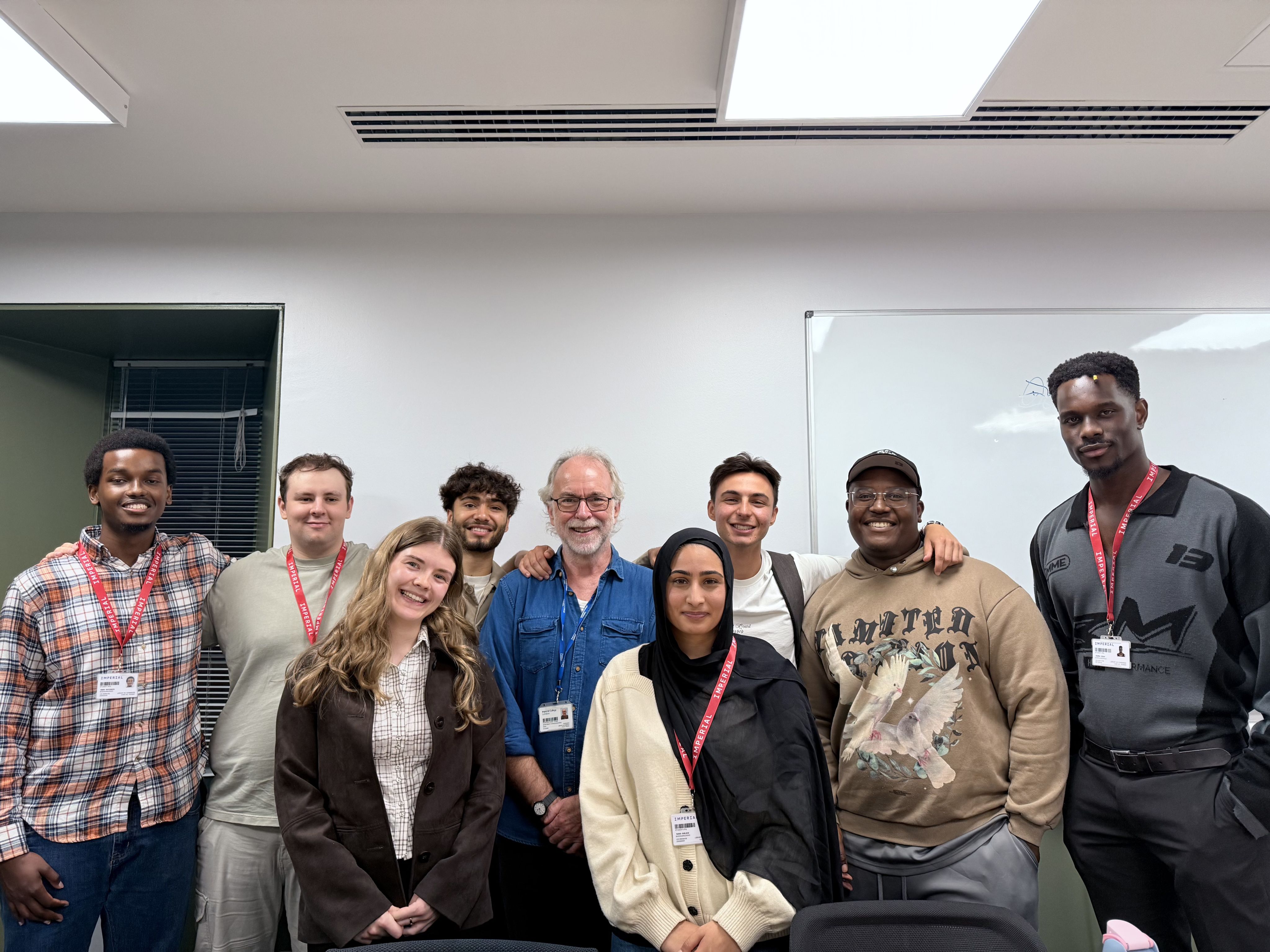 Group photo of Hannah with a staff member and other students