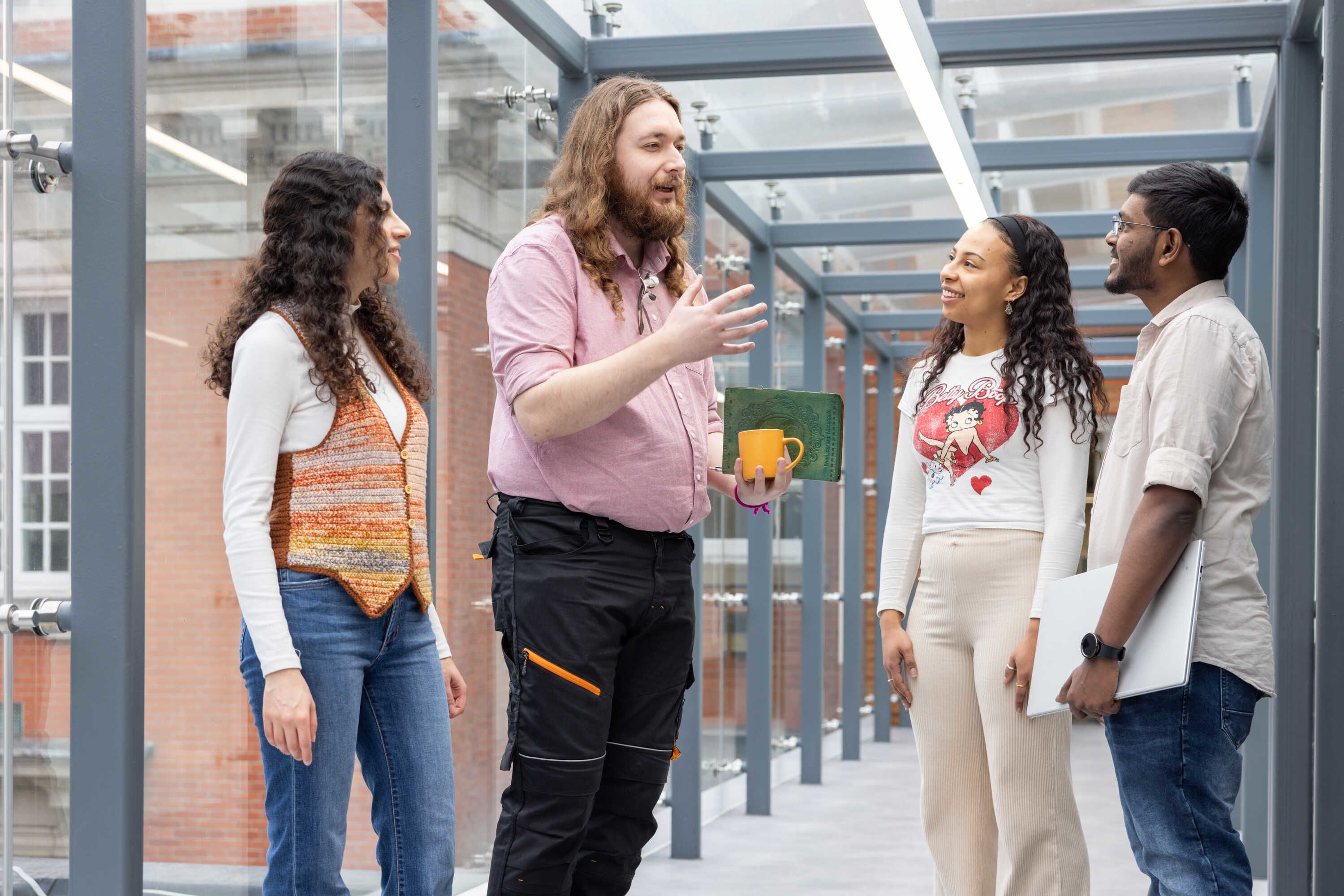 Janarathanan speaking to a group of people