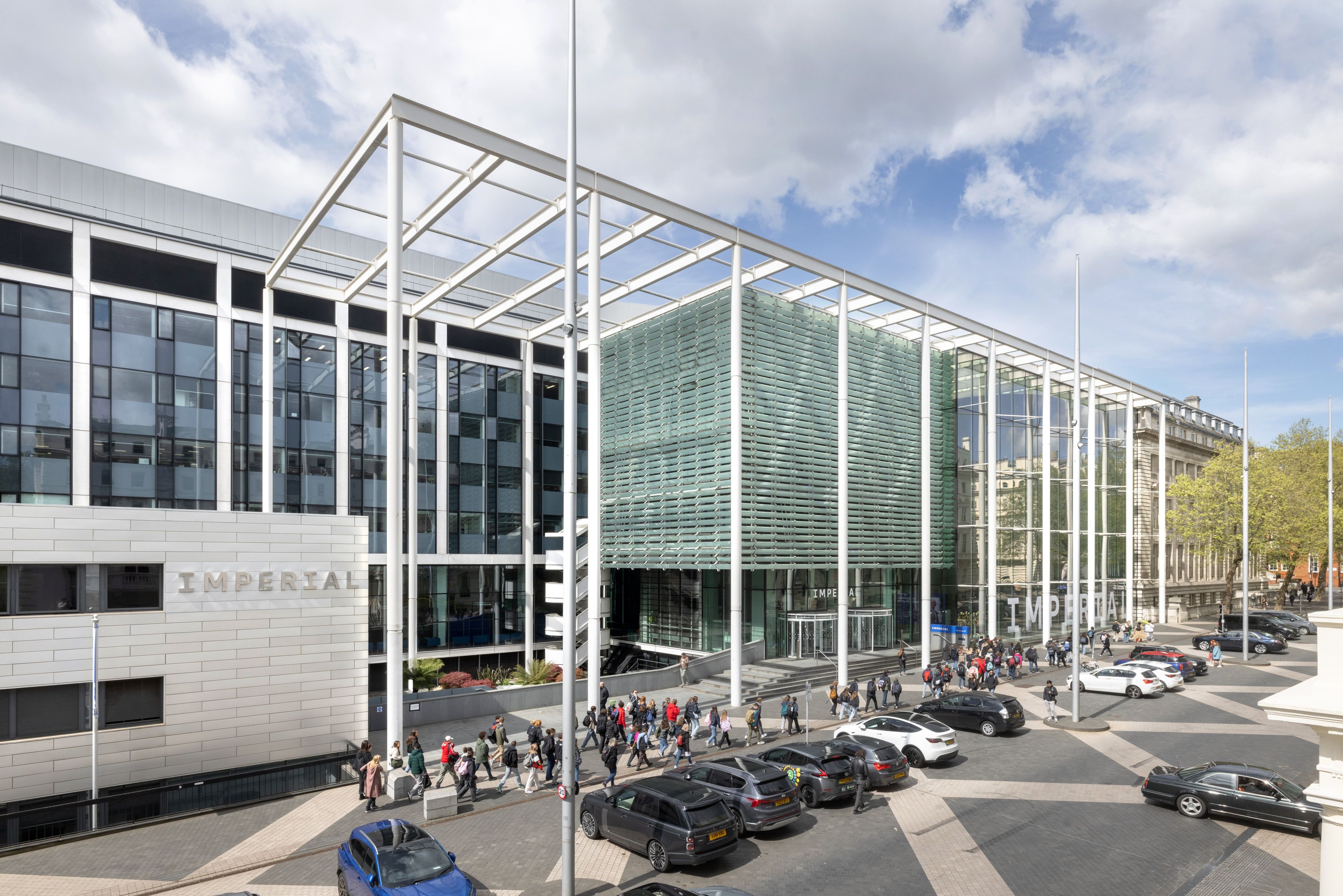 A large, modern building with an Imperial logo on the side