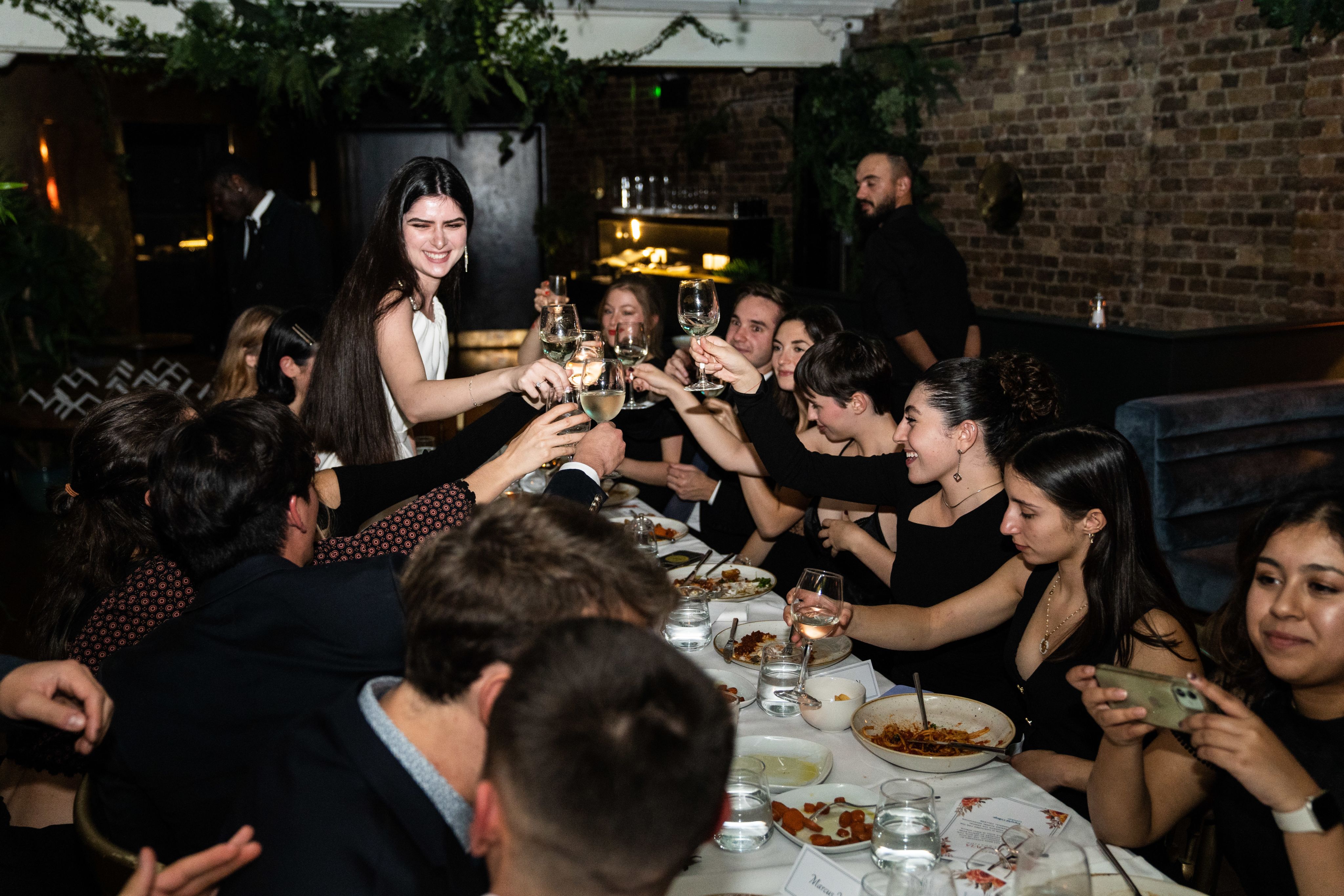 Rea with friends raising a glass of wine