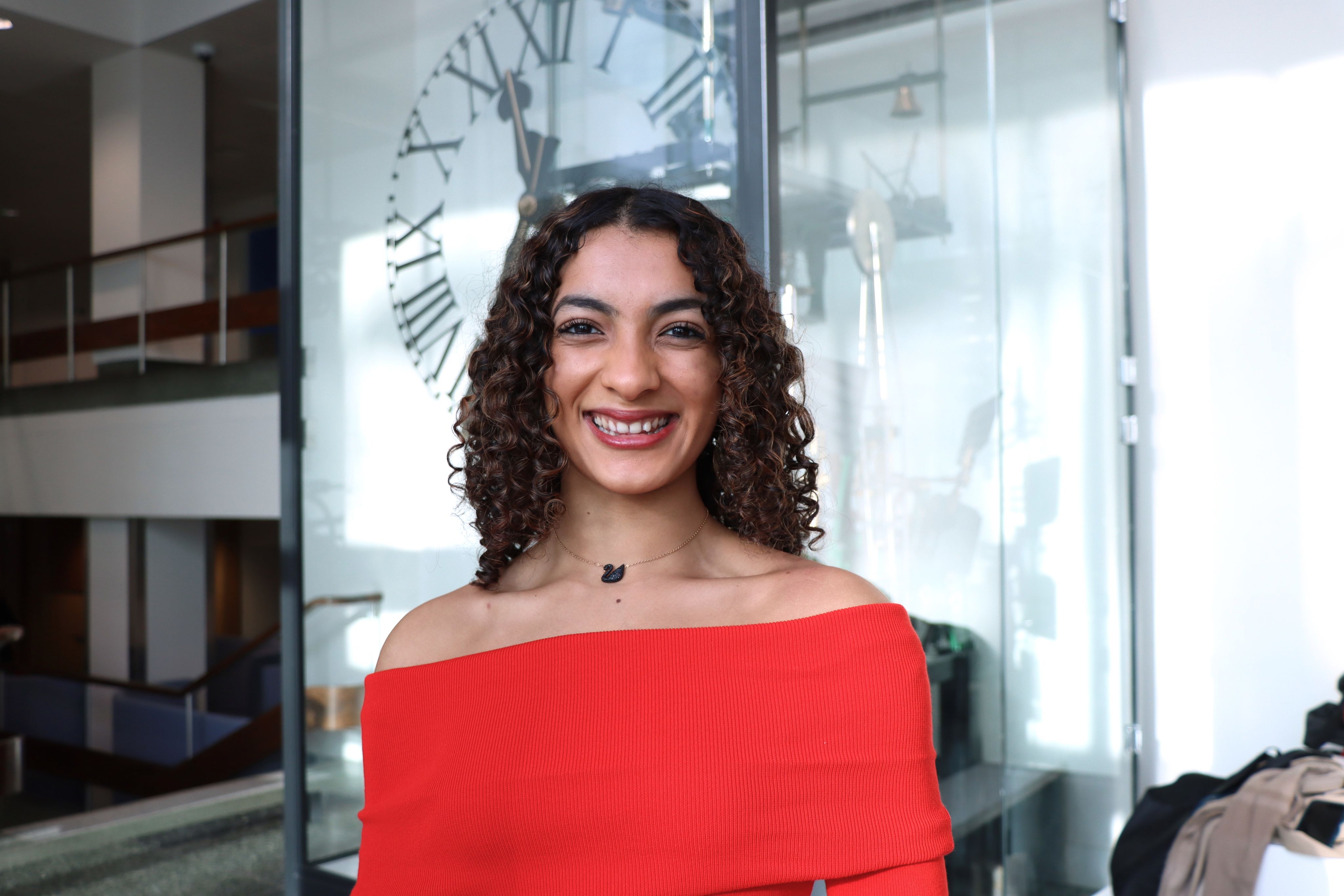 Sneha smiling at the camera.