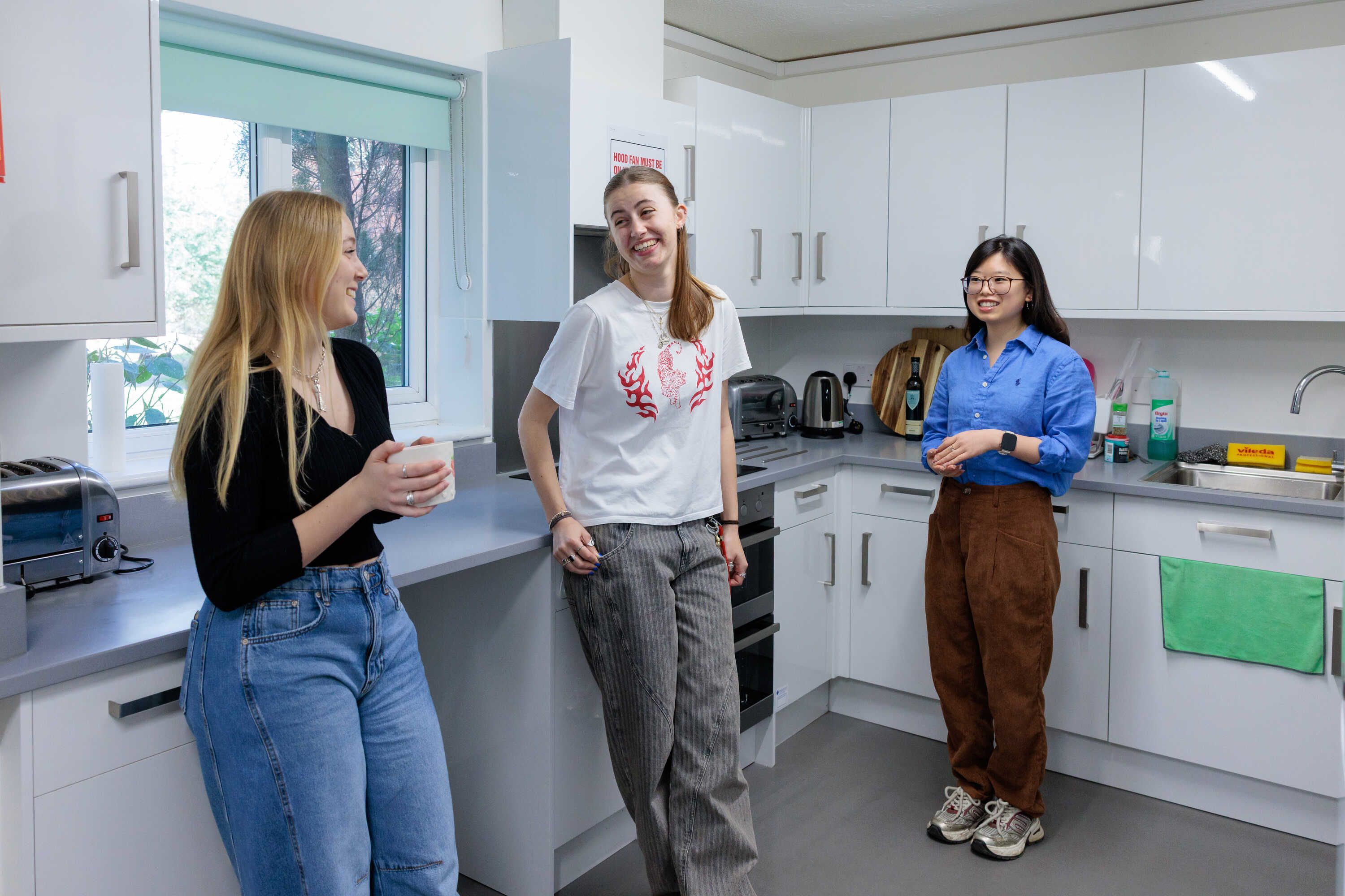 Students chatting in a kitchen