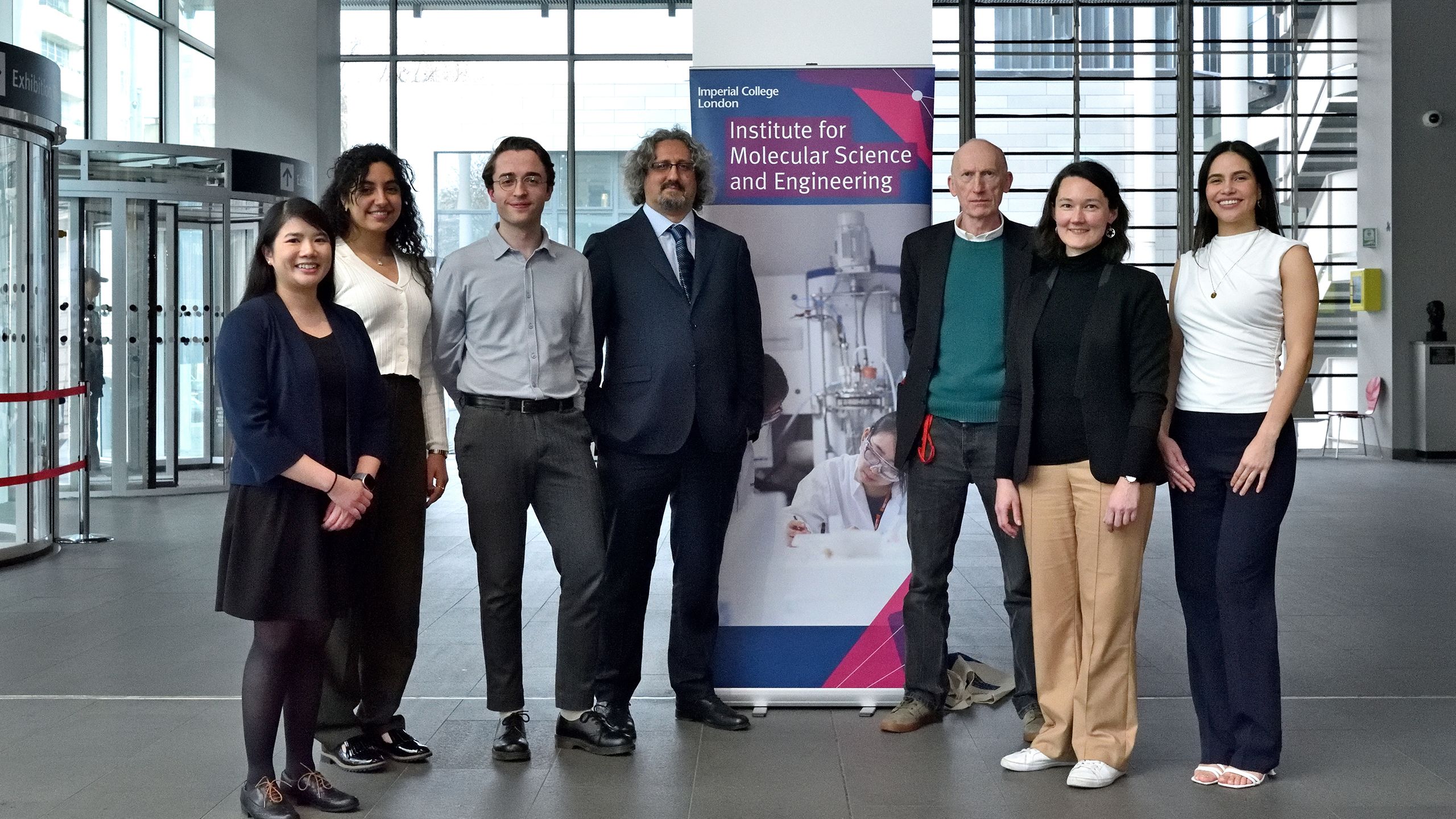 Group photo of researchers in Imperial's Main Entrance lobby